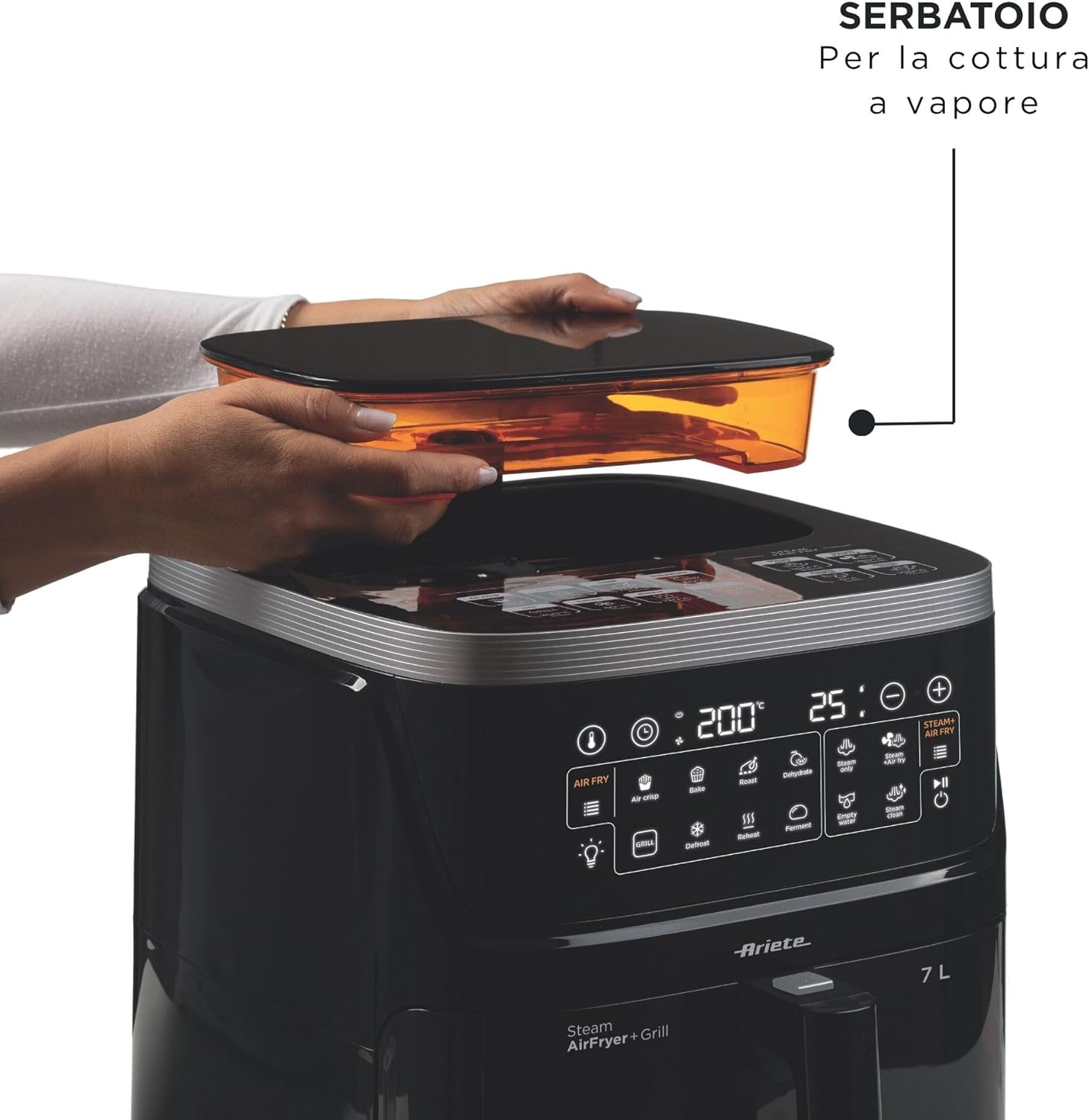 A person's hands placing the water reservoir onto the top of the Ariete 4636 Air Fryer