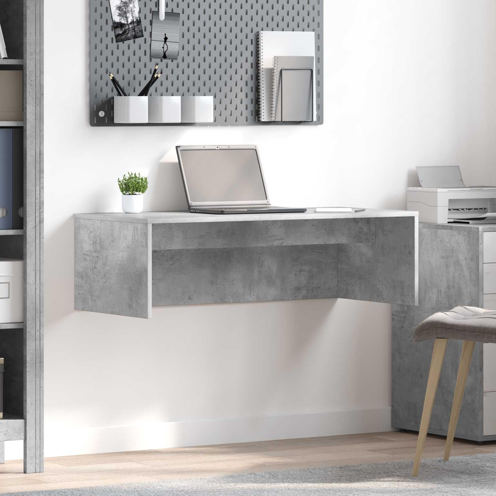 Bureau peu encombrant gris béton pour télétravail et petite étude
