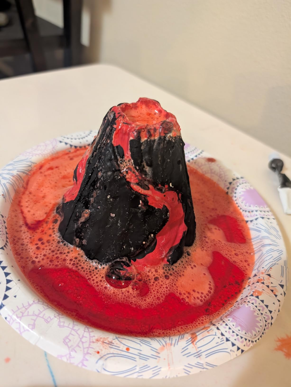 National Geographic Earth Science Kit showing various experiment setups including crystal growing and volcano building