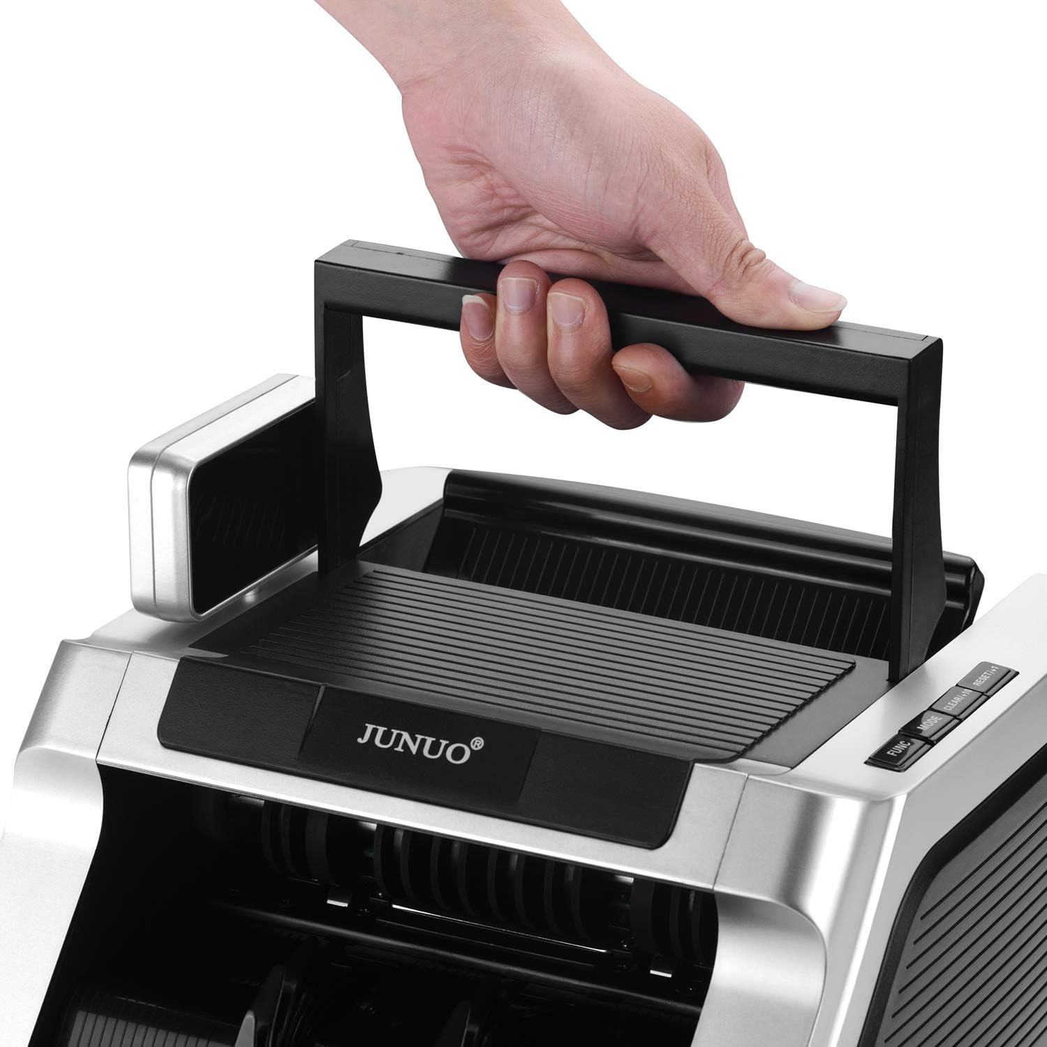Hand holding the retractable handle of the JUNUO C05 Money Counter