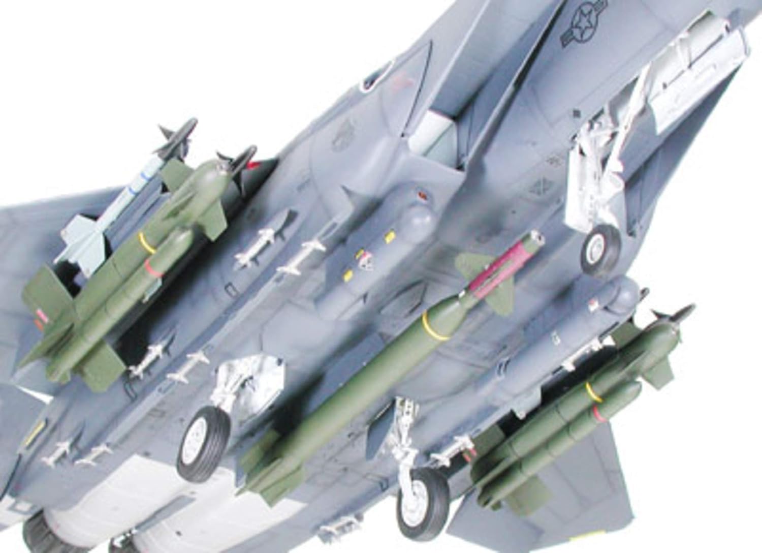 Underside view of the F-15E Strike Eagle model, showcasing the detailed landing gear and various attached bombs and missiles.
