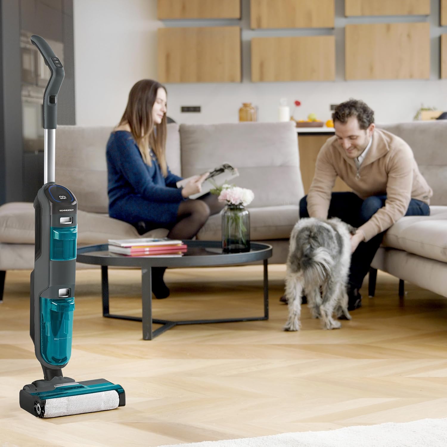 User operating the SCHNEIDER SCVCO23DBE Multi-task Stick Vacuum Cleaner on a light-colored hard floor