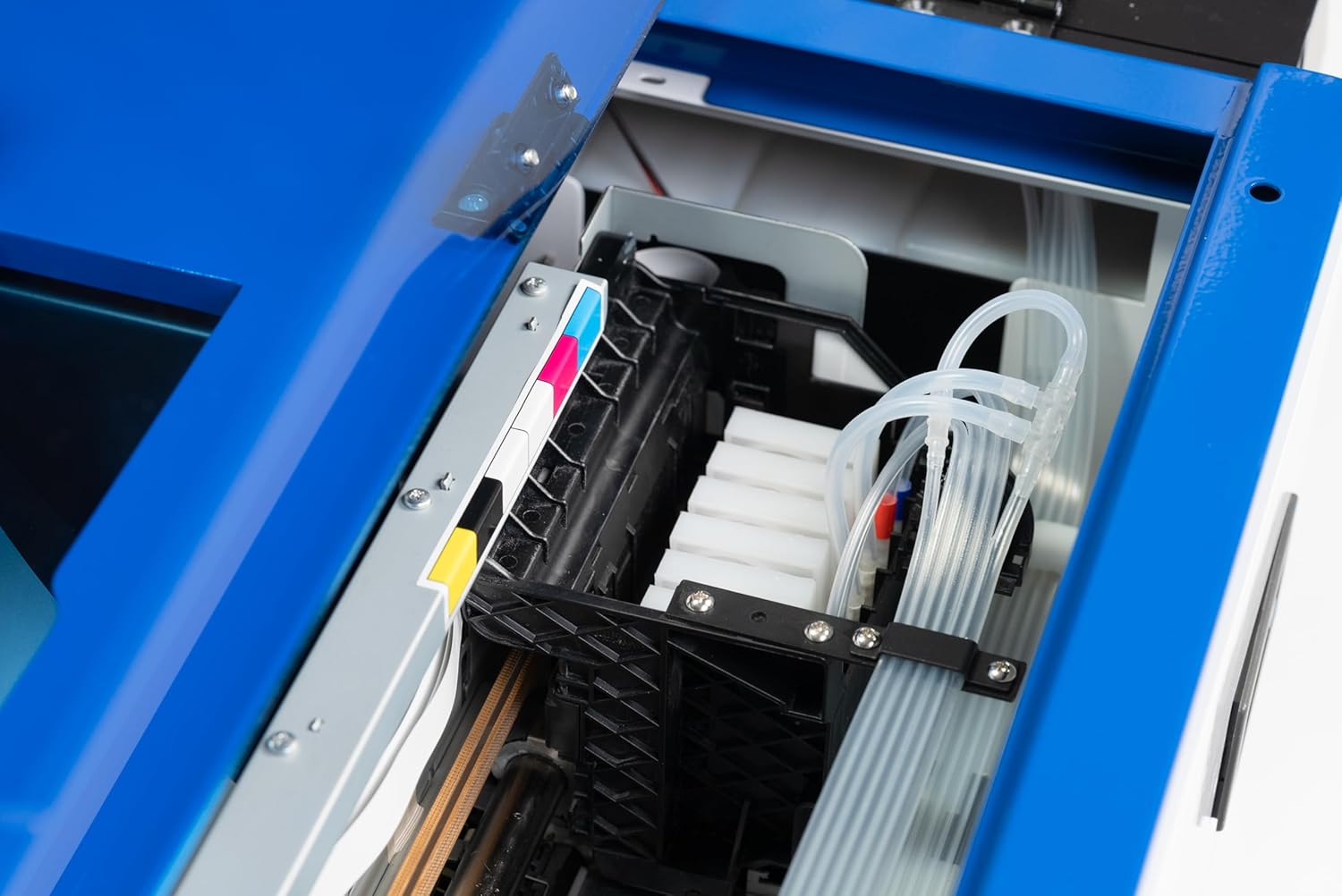 Internal view of a DTF printer showing ink lines connected to dampers.