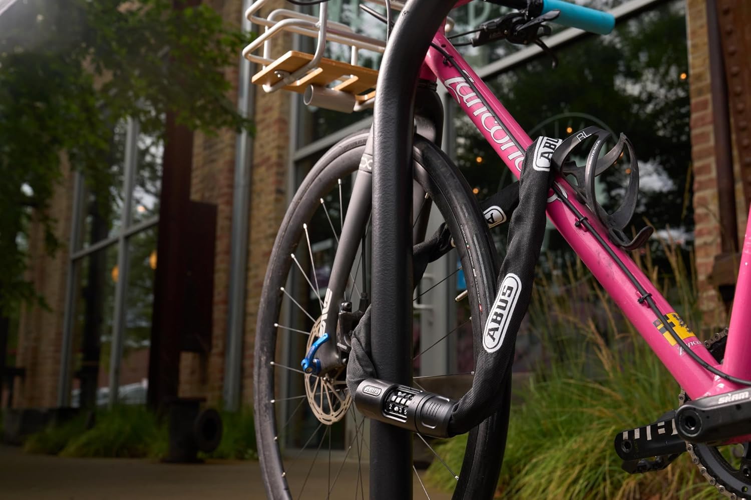 ABUS Chain Lock 8808C securing a bicycle to a bike rack
