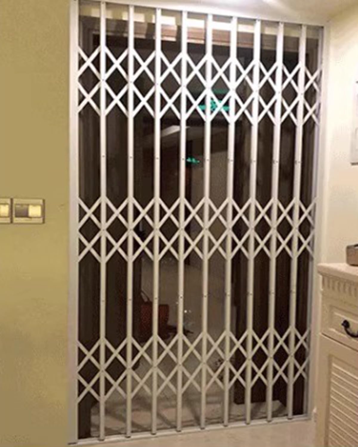 Grille de sécurité télescopique avec serrure double face pour portes et fenêtres