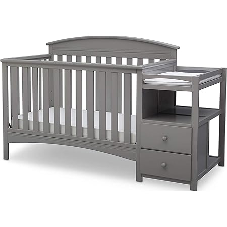 white crib with changing table