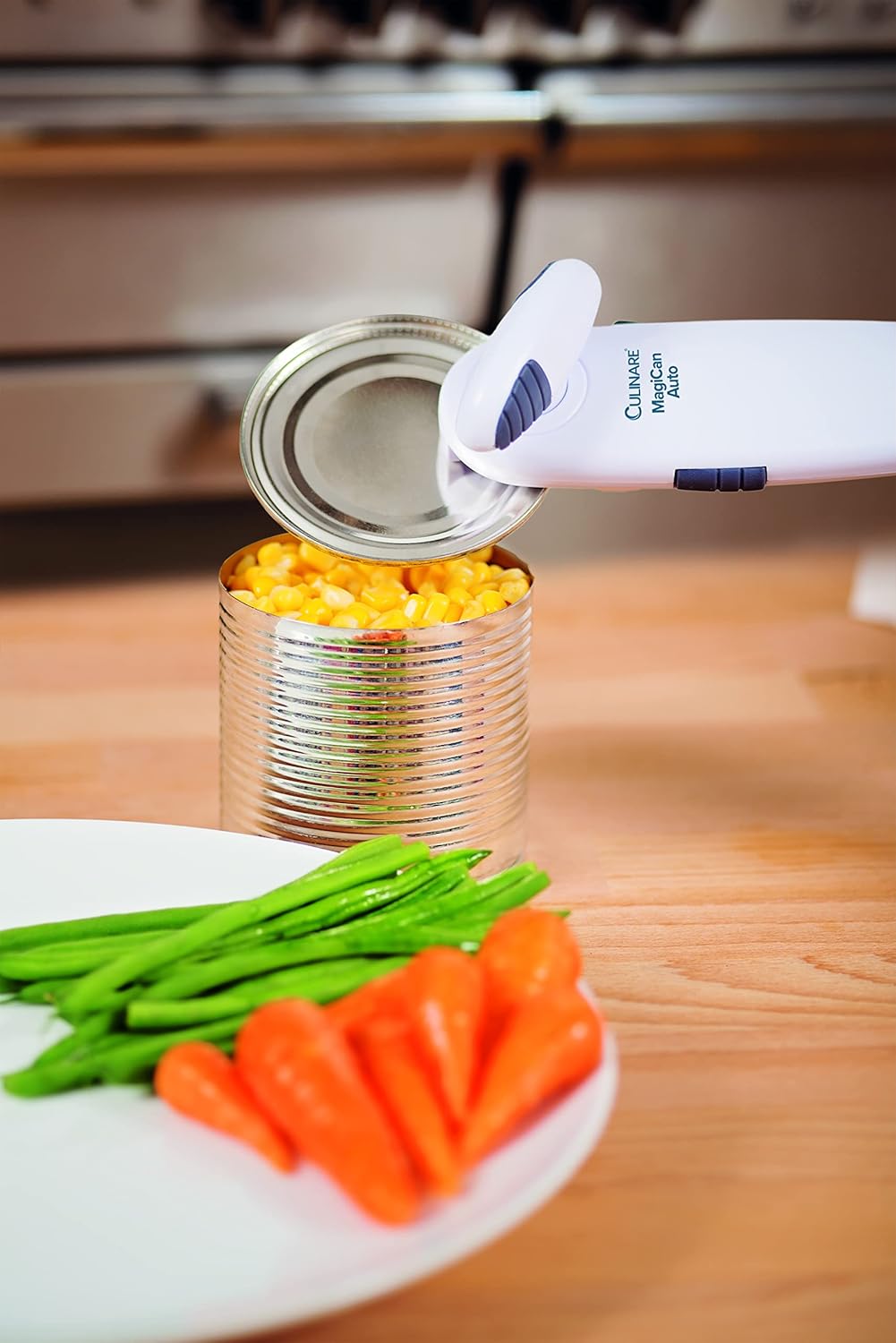 CULINARE MagiCan Auto 2 Can Opener in use, opening a can of corn