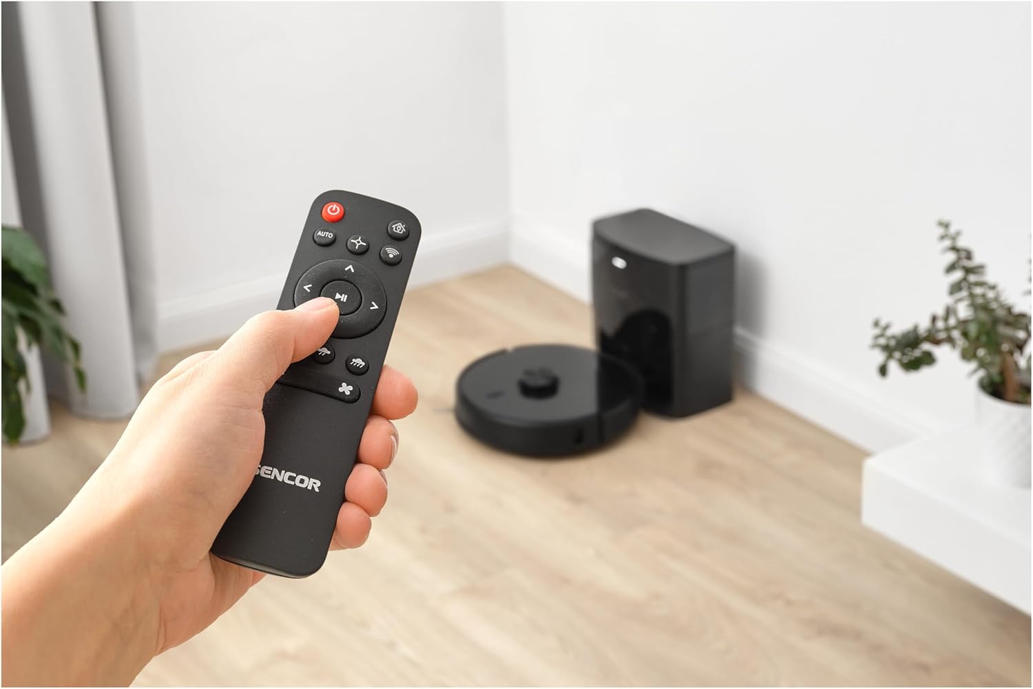 SENCOR SRV 9185BK robot vacuum cleaning a living room, illustrating its systematic cleaning path.