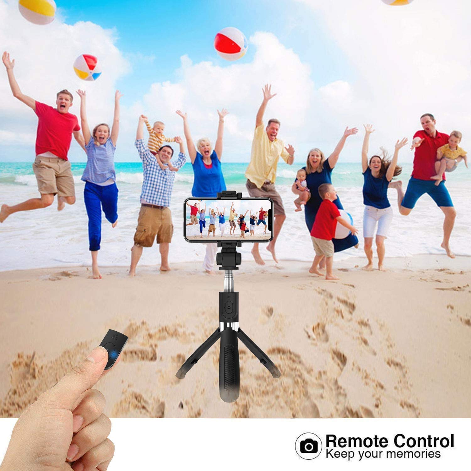 Image of the SO3 Selfie Stick used as a tripod on a beach, with a group of people jumping in the background, emphasizing remote control functionality.