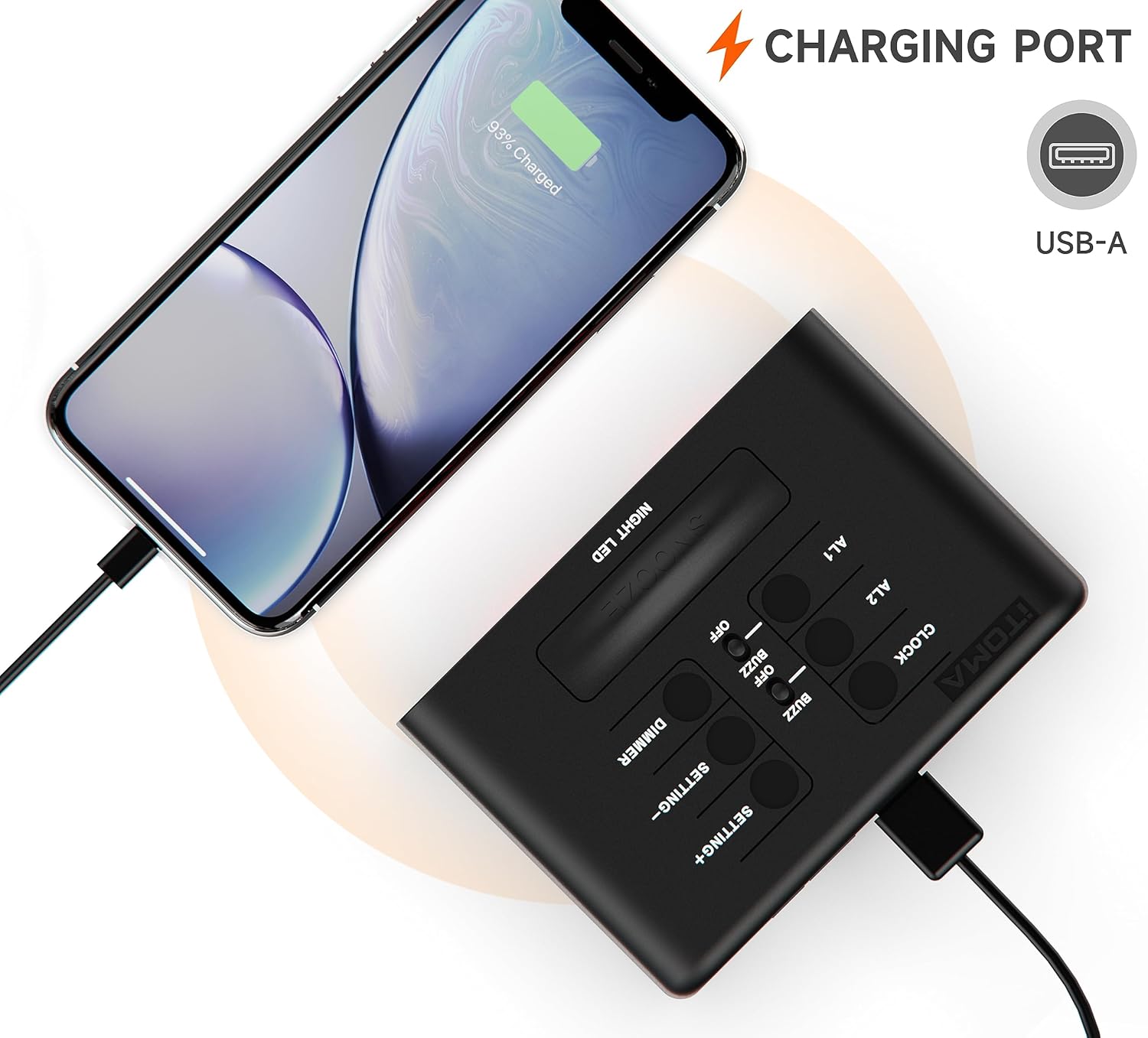 Alarm clock with a smartphone connected to its USB charging port