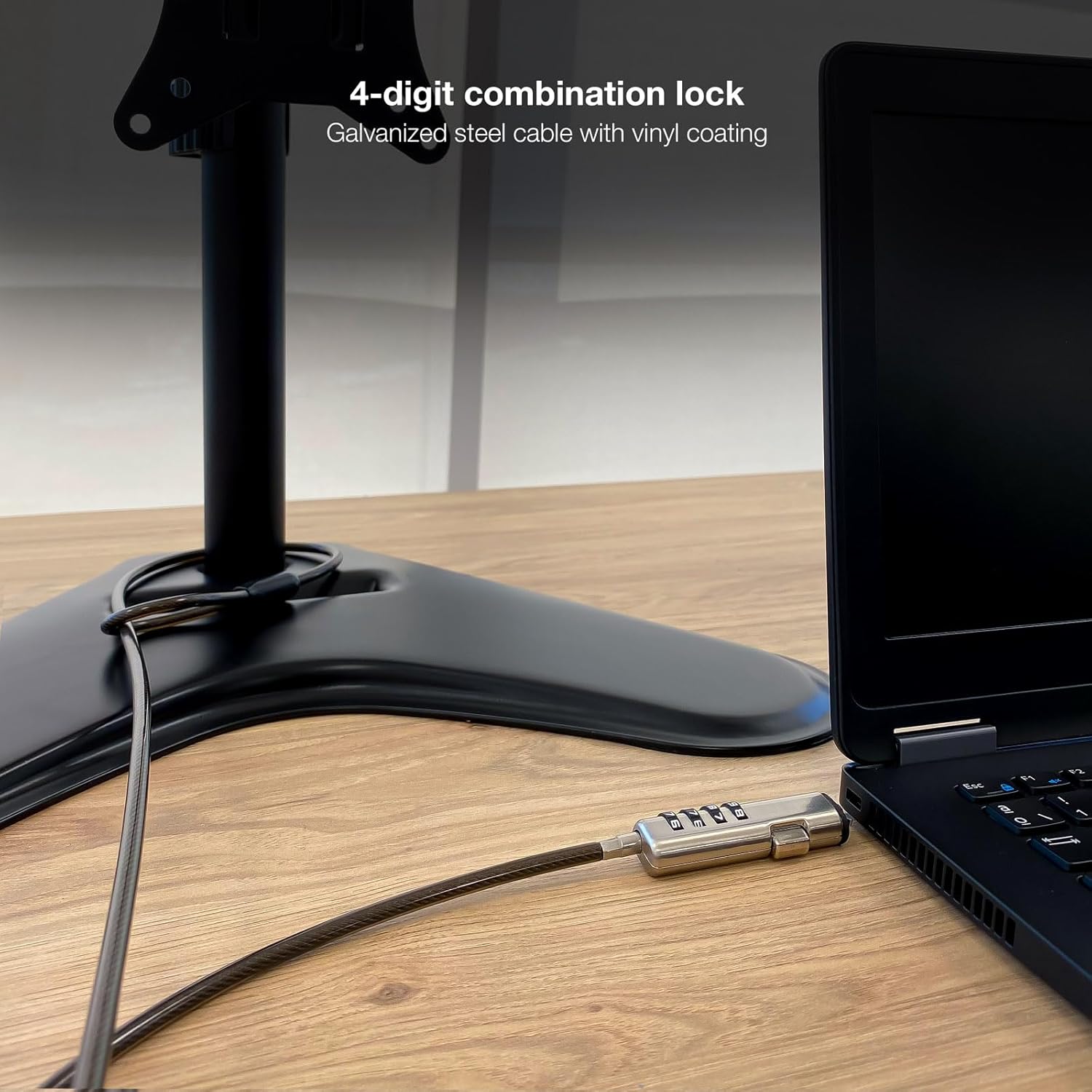 TooQ security cable securing a laptop to a desk