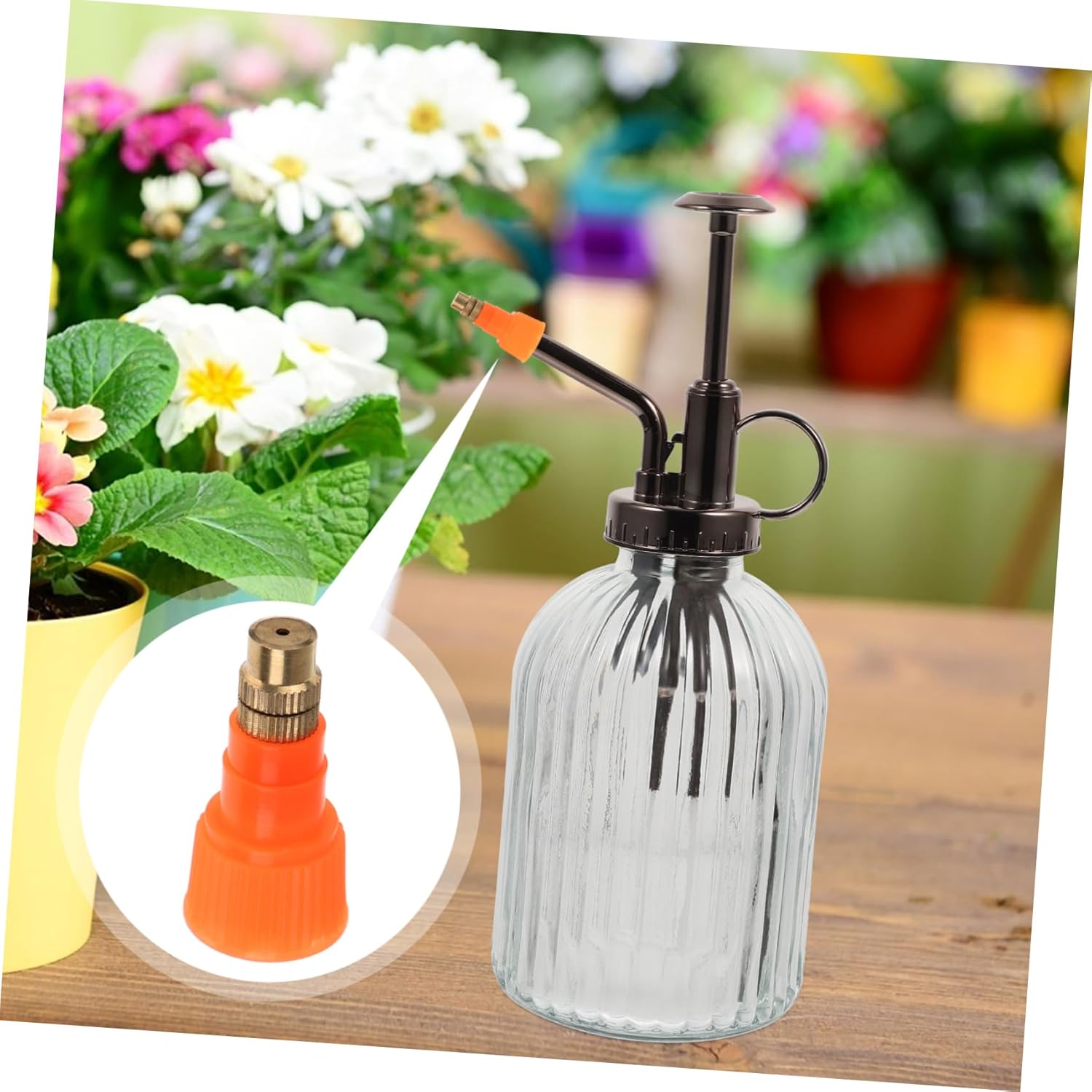 A Parliky spray nozzle next to a clear glass spray bottle, illustrating how the nozzle attaches.