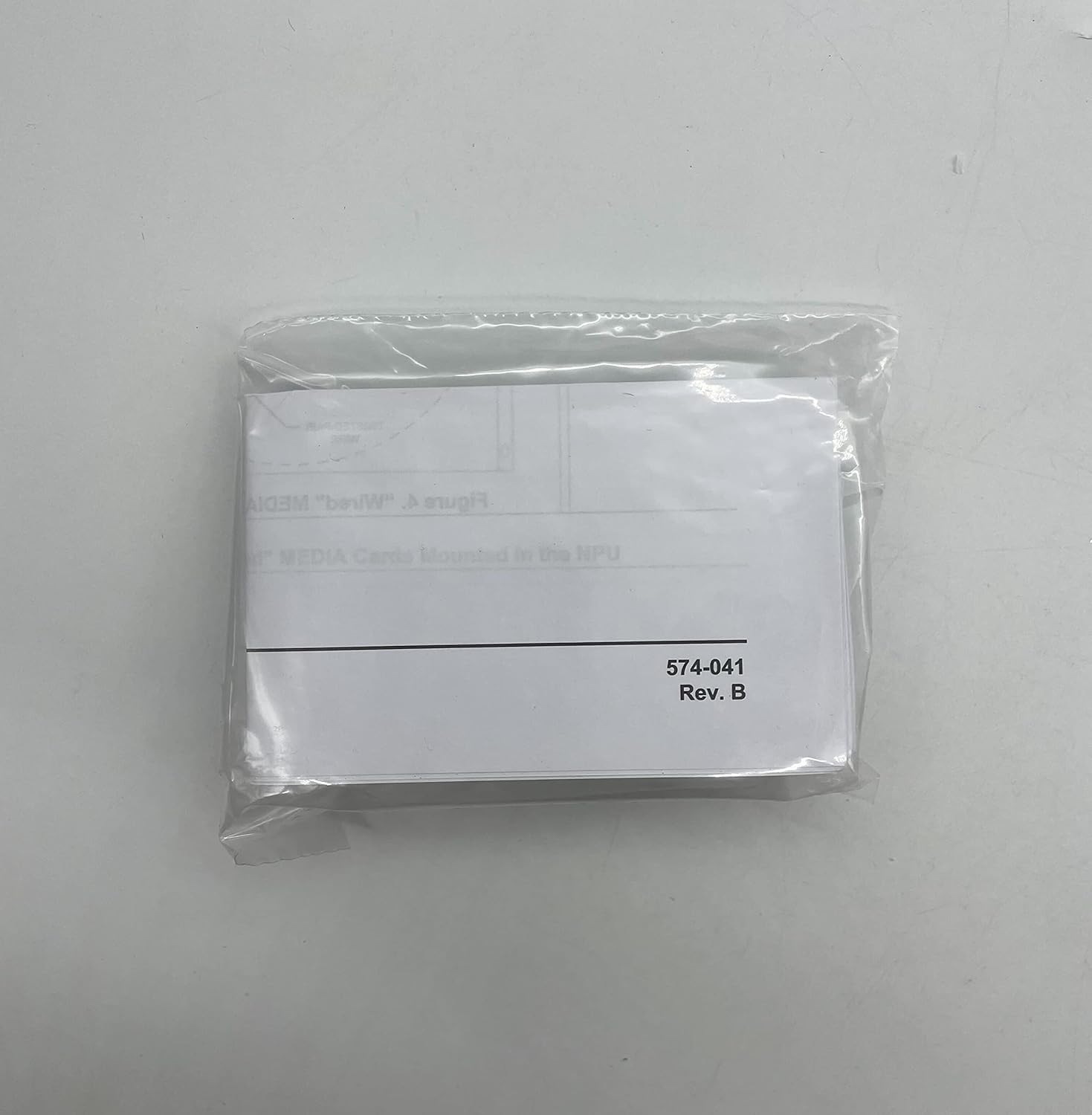 Small plastic bag with '574-041 Rev. B' label