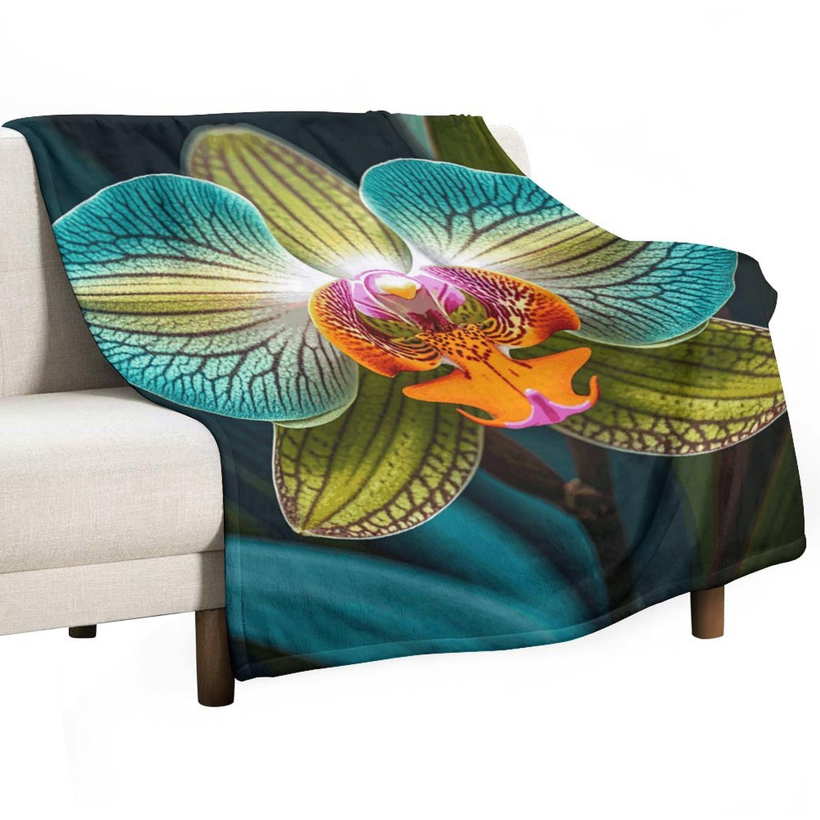 Plaid en flanelle orchidée bleu sarcelle pour vos soirées cocooning sur le canapé ou en voyage