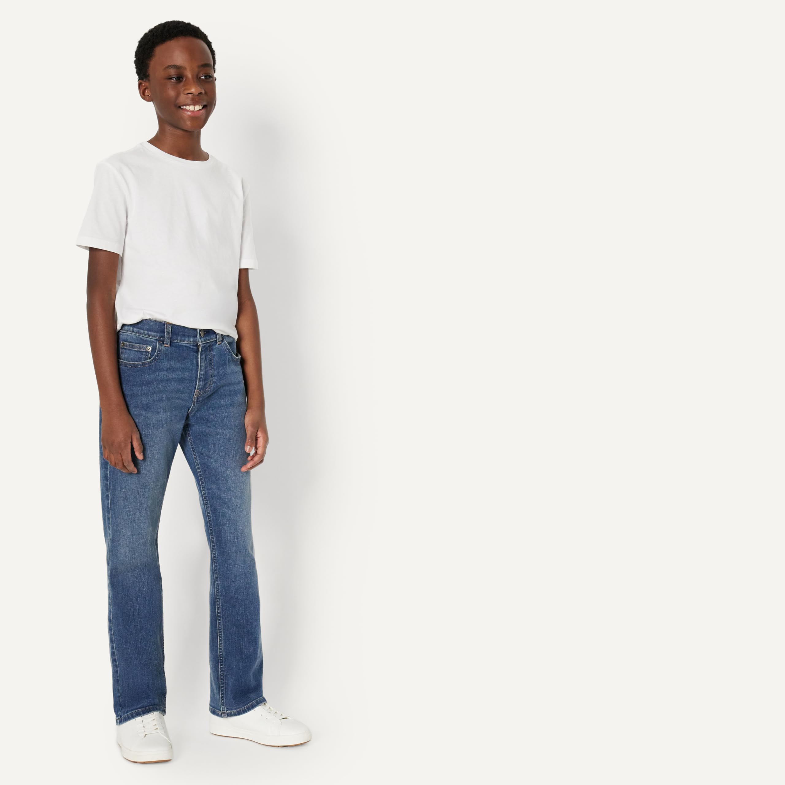 Close-up of the denim fabric and stitching on Amazon Essentials Boys' Bootcut Jeans.