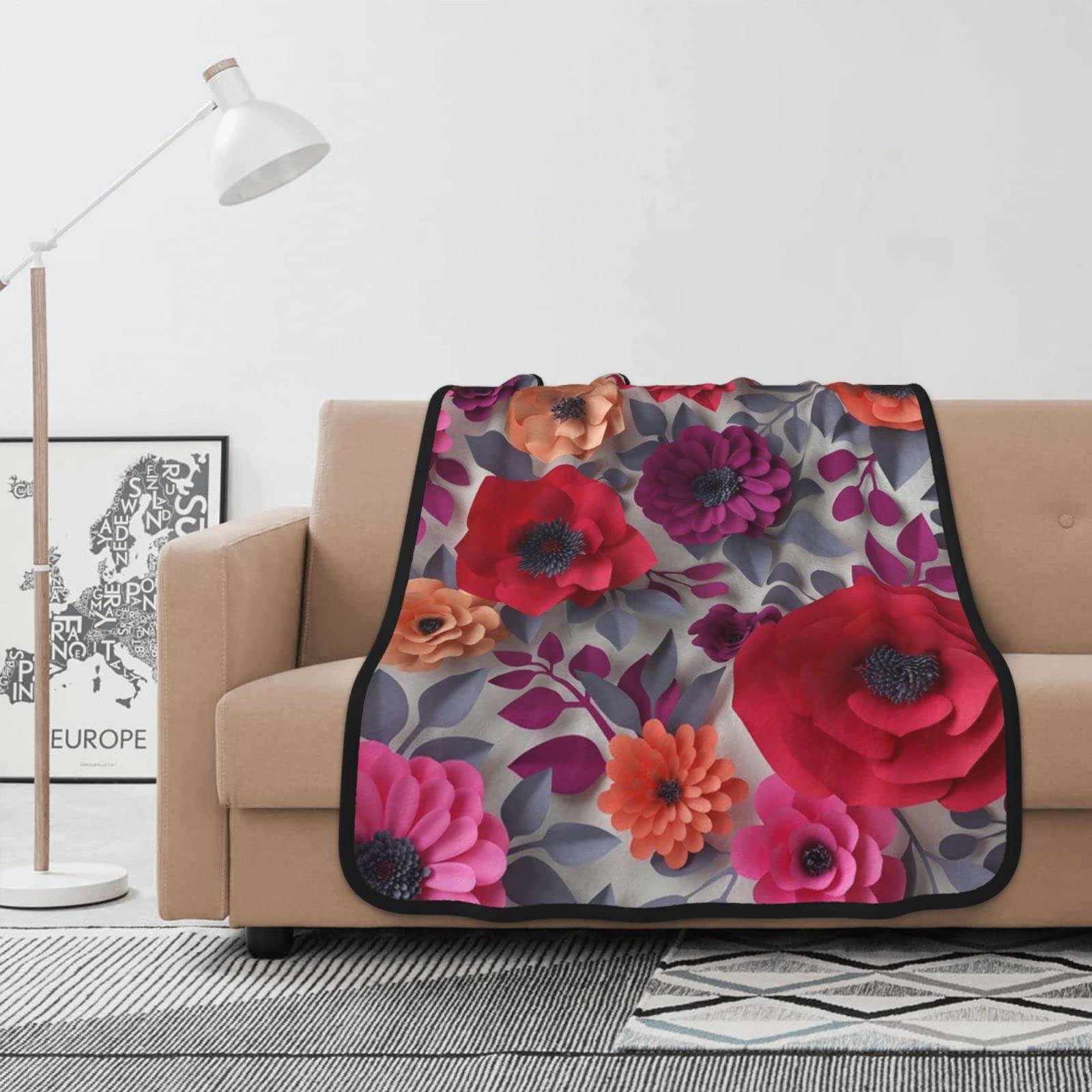 Couverture pour canape et lit a motif floral rose pour des soirees cocooning au chaud
