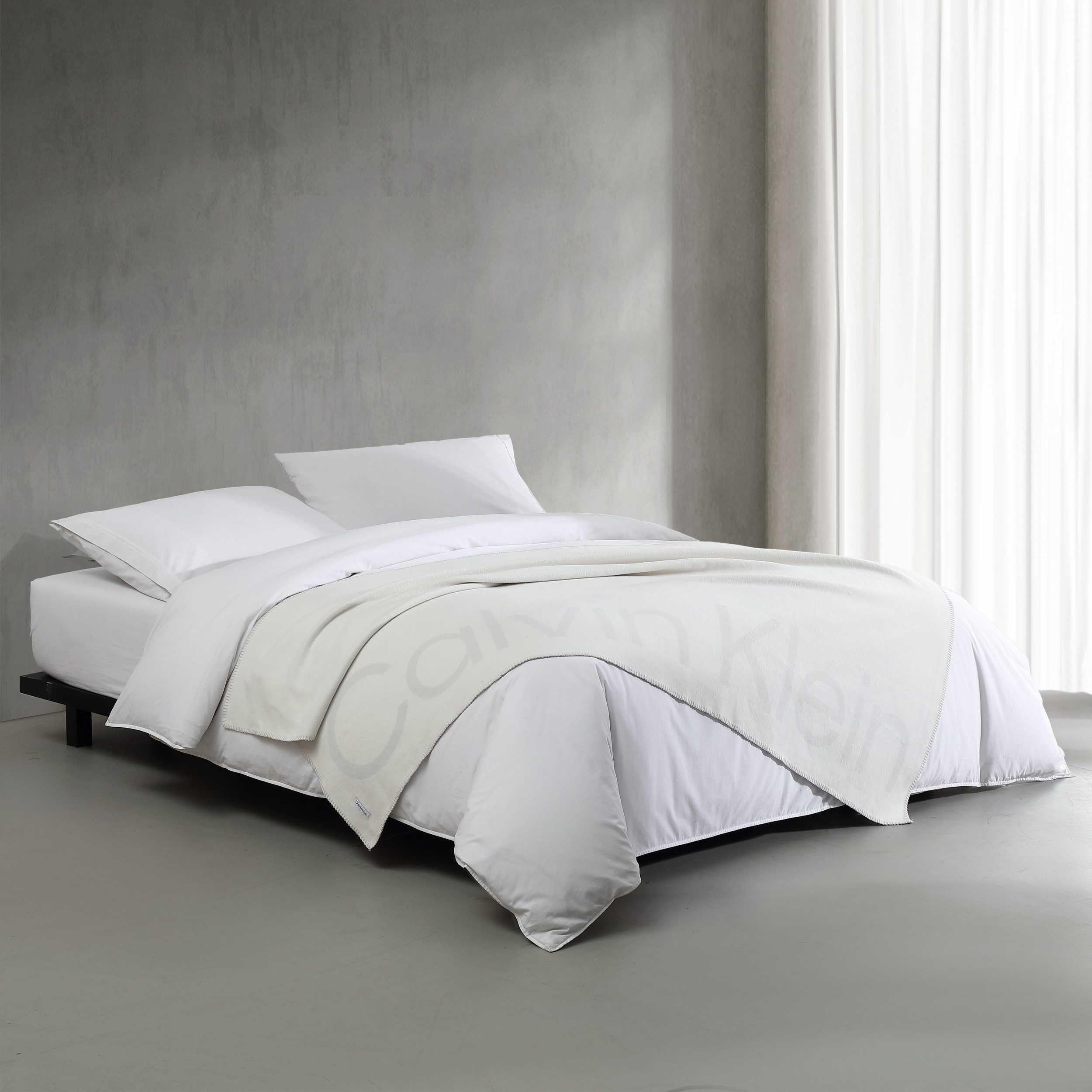 Couvre-lit en coton Calvin Klein pour remplacer les plaids lourds et trop chauds