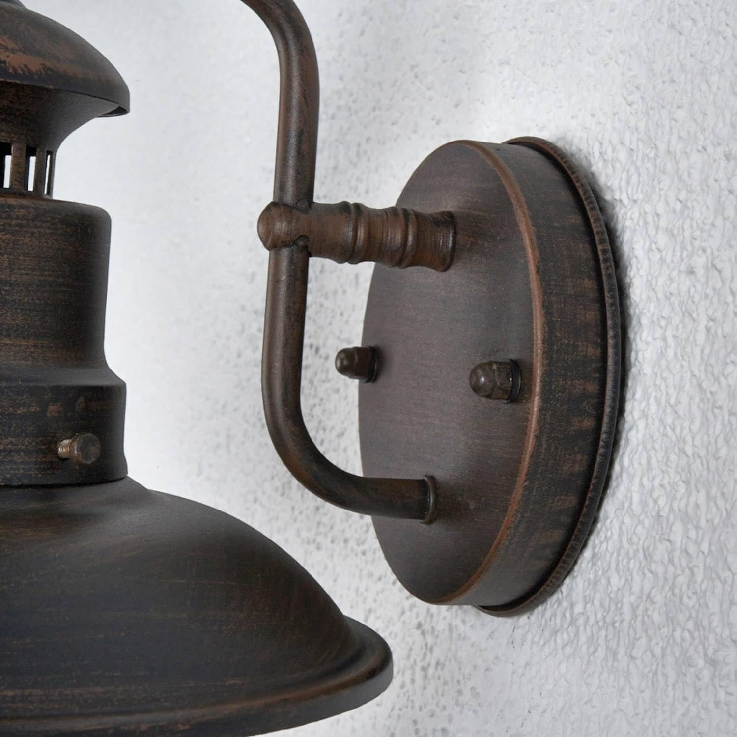 طرف view of the Lindby Eddie Outdoor Wall Light, showing the wall mount and arm