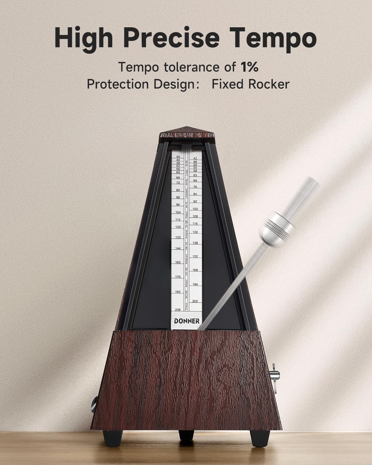 Close-up of the Donner DPM-1 metronome's pendulum and tempo scale, showing the sliding weight set to a specific BPM.
