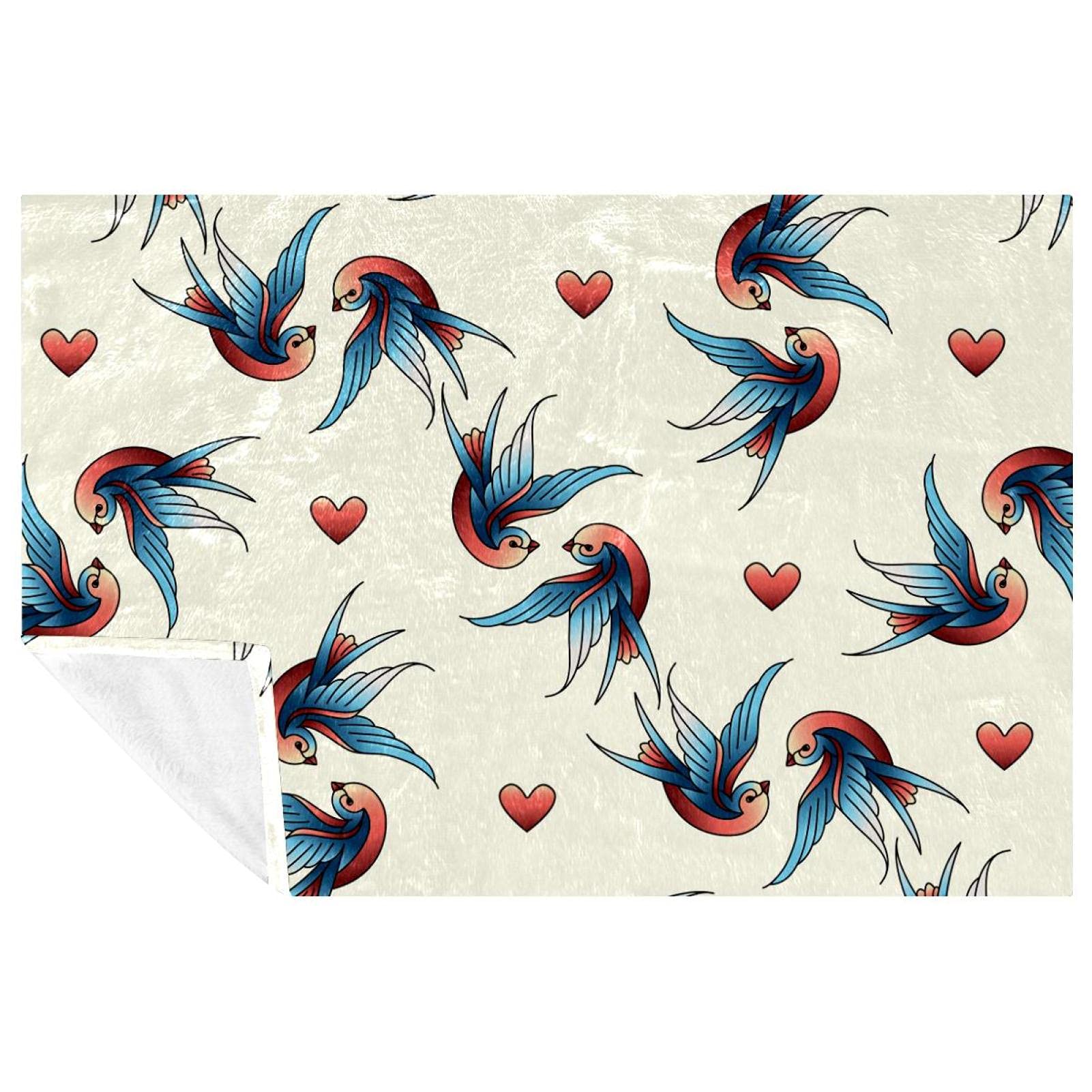 Couverture motif hirondelles aux finitions soignées pour literie haut de gamme
