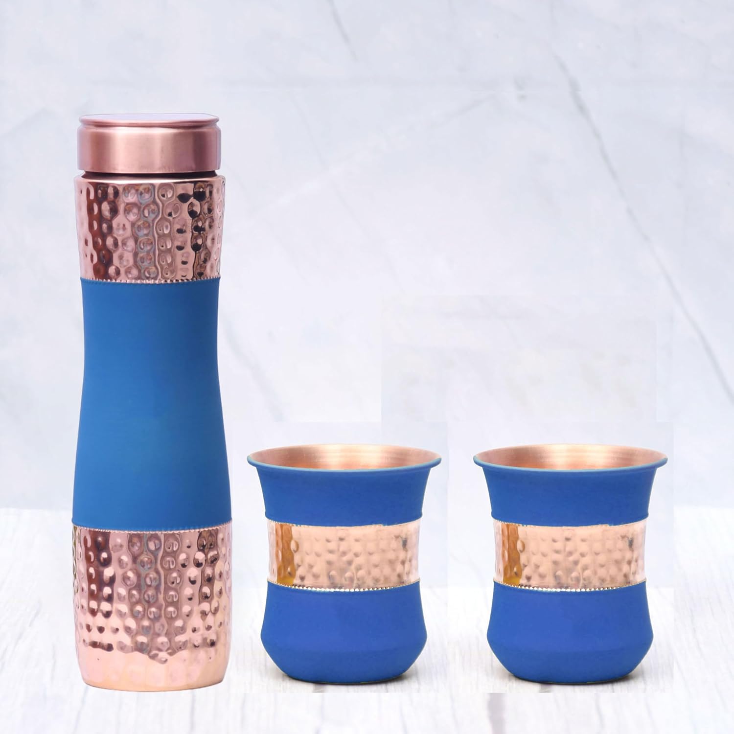 Pure Copper Water Bottle Silk Blue Half Hammered with 2 Dholak Glasses (Set of 3) Capacity 1450 ML Silk Blue Copper Bottle:- 2.83x10.6 inch Glass:-8x8x10.5 CM