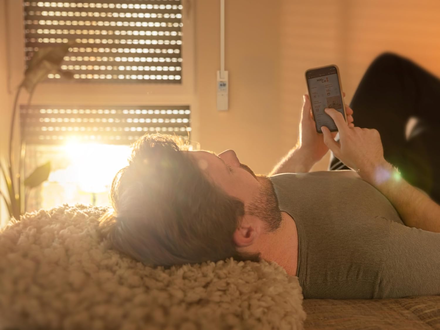 HOMEPILOT RolloTron Premium Smart Belt Winder installed in a home setting