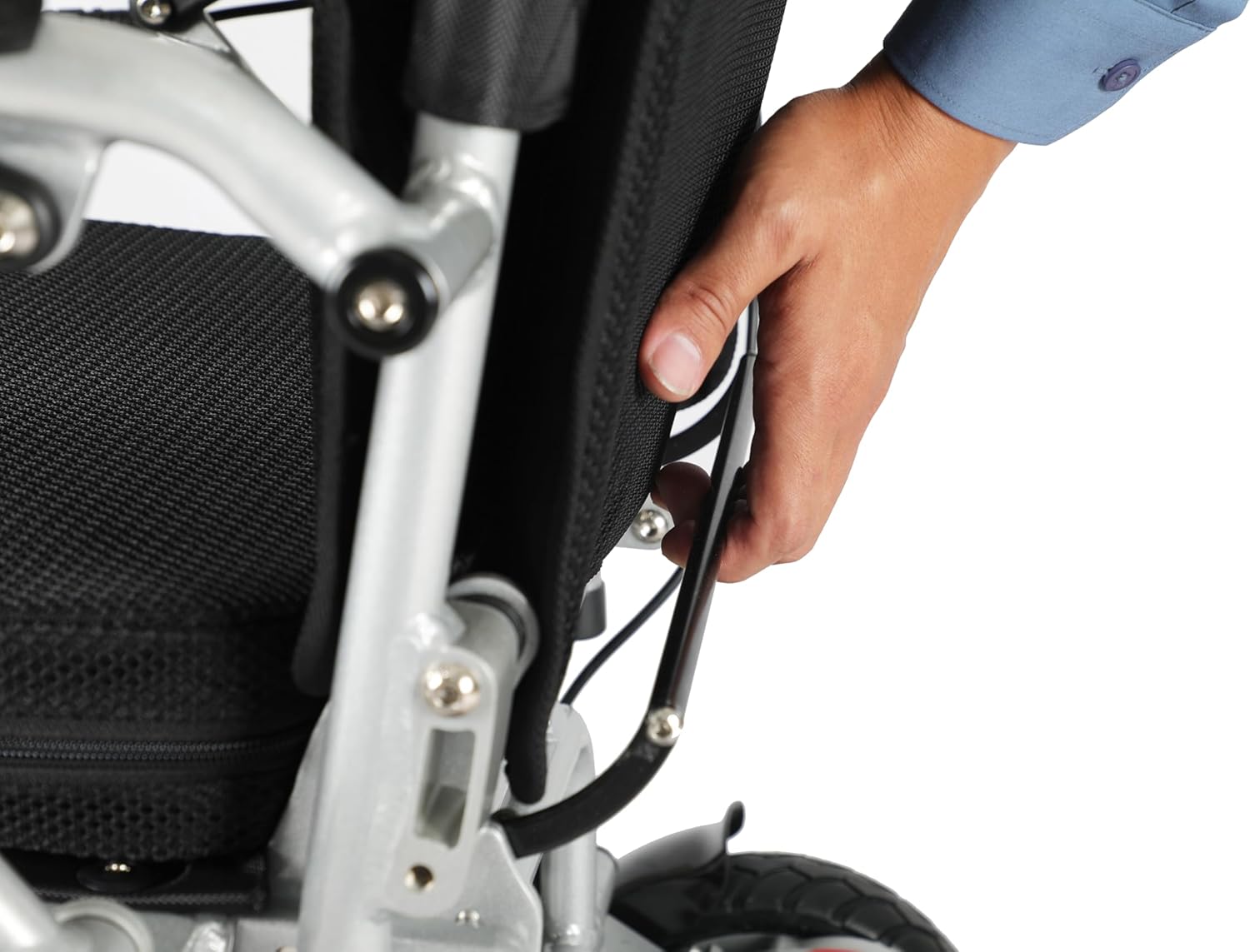 Hand adjusting the seat of the Phoenix wheelchair