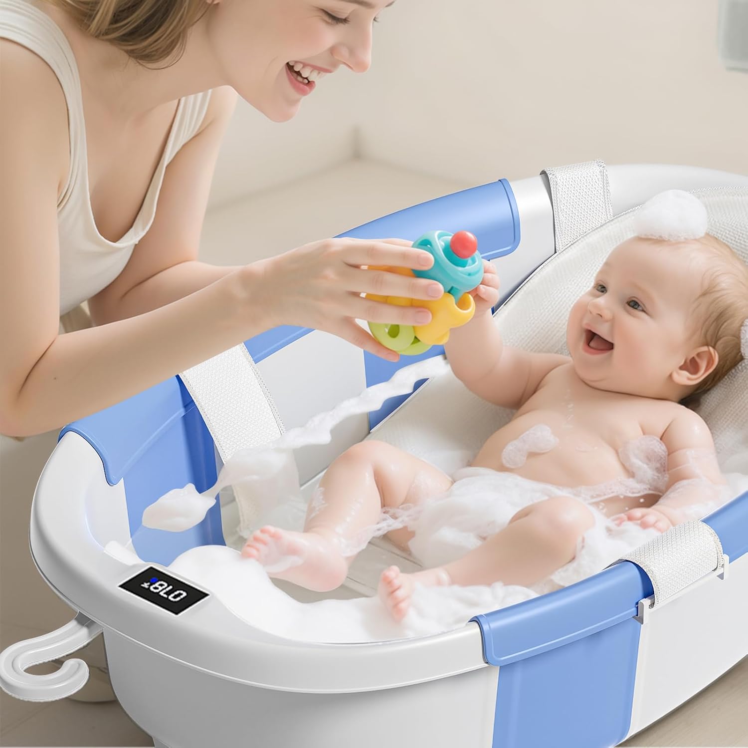collapsible baby bathtub with soft cushion and thermometer, newborn to toddler tub 0-36 months with toy storage mesh bag, portable travel bath for infants (blue)