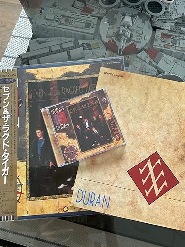 Seven And The Ragged Tiger: Amazon.co.uk: CDs & Vinyl