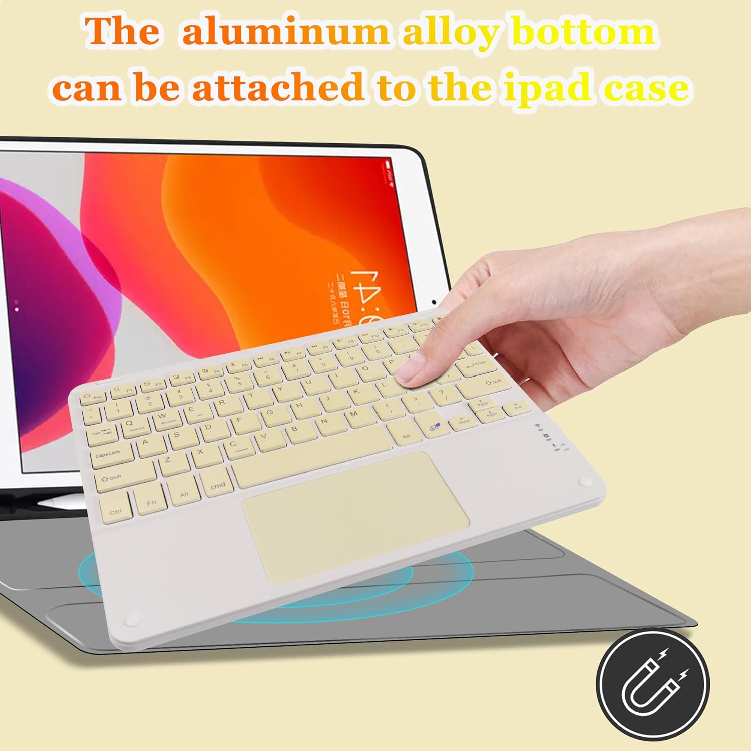 A hand attaching the keyboard to an iPad case using its magnetic bottom.