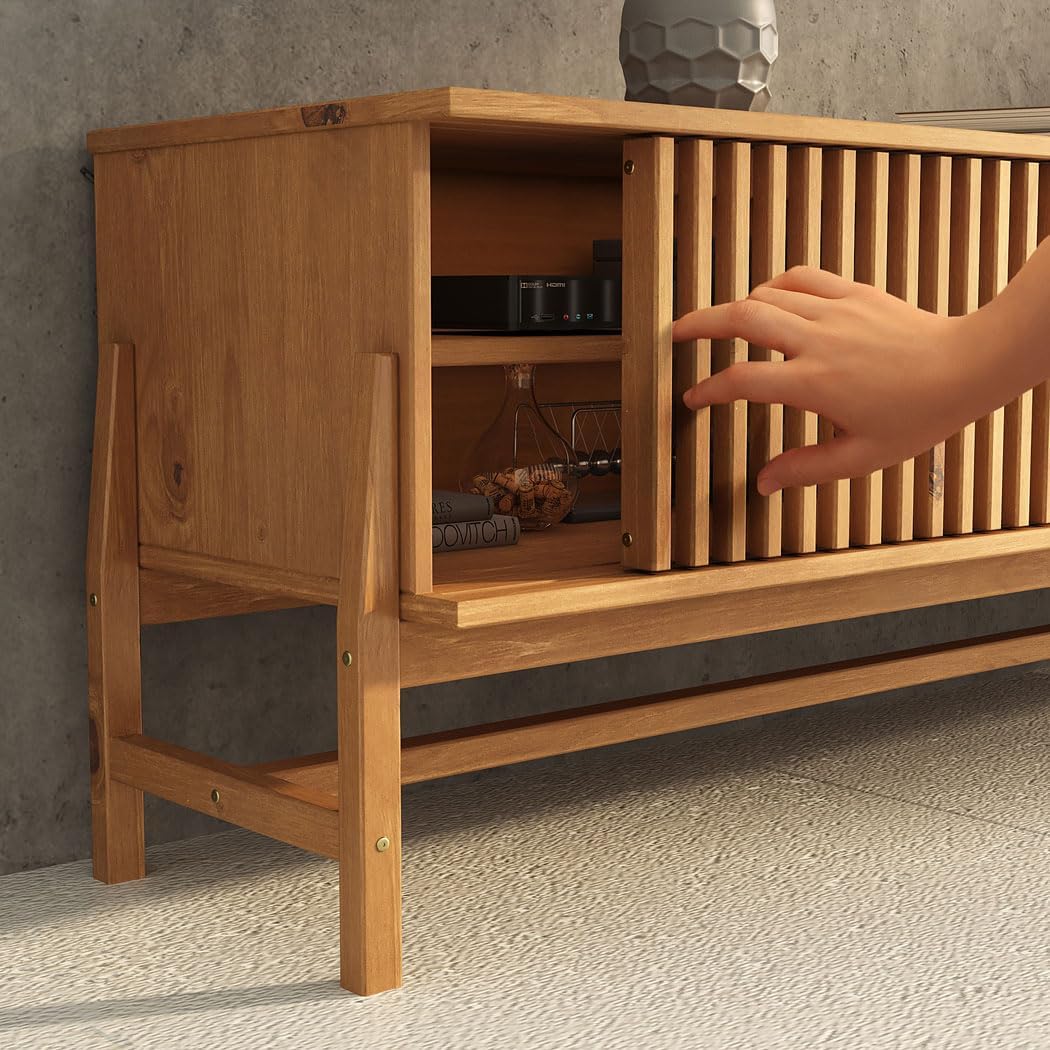 Hand demonstrating the sliding door mechanism on the TV stand
