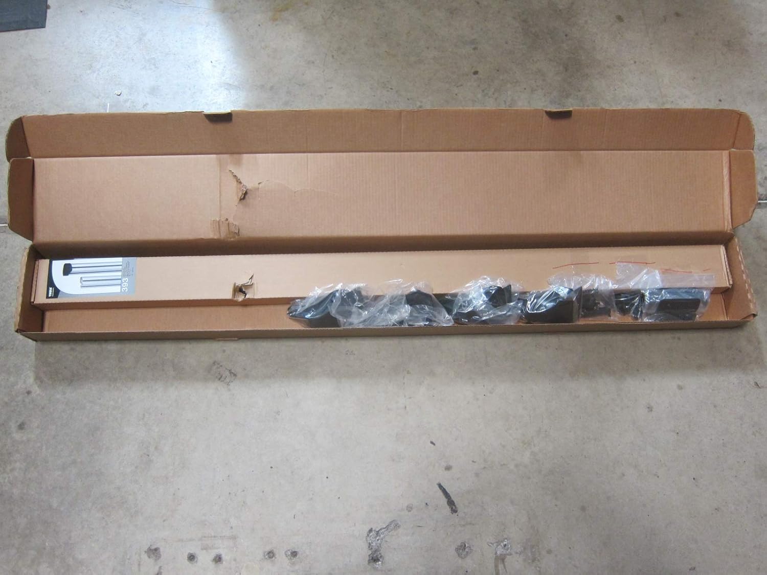 Two Mopar Sport Utility Bars installed across the bed of a red Ram 1500 DT pickup truck