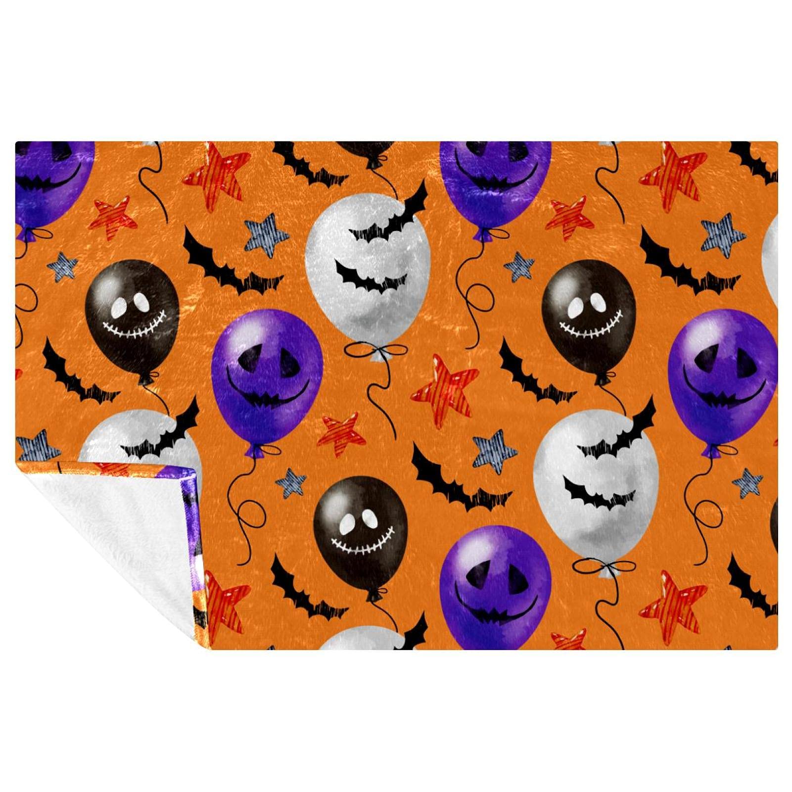 Couverture chaude Halloween motif ballon orange contre le froid sur le lit
