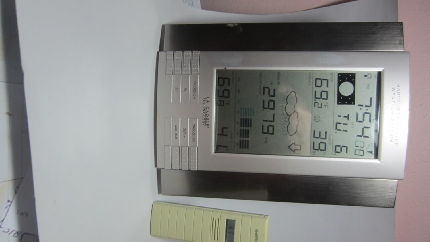 La Crosse Technology WS-8035U-IT-SAL display showing indoor/outdoor temperature, humidity, pressure, and forecast