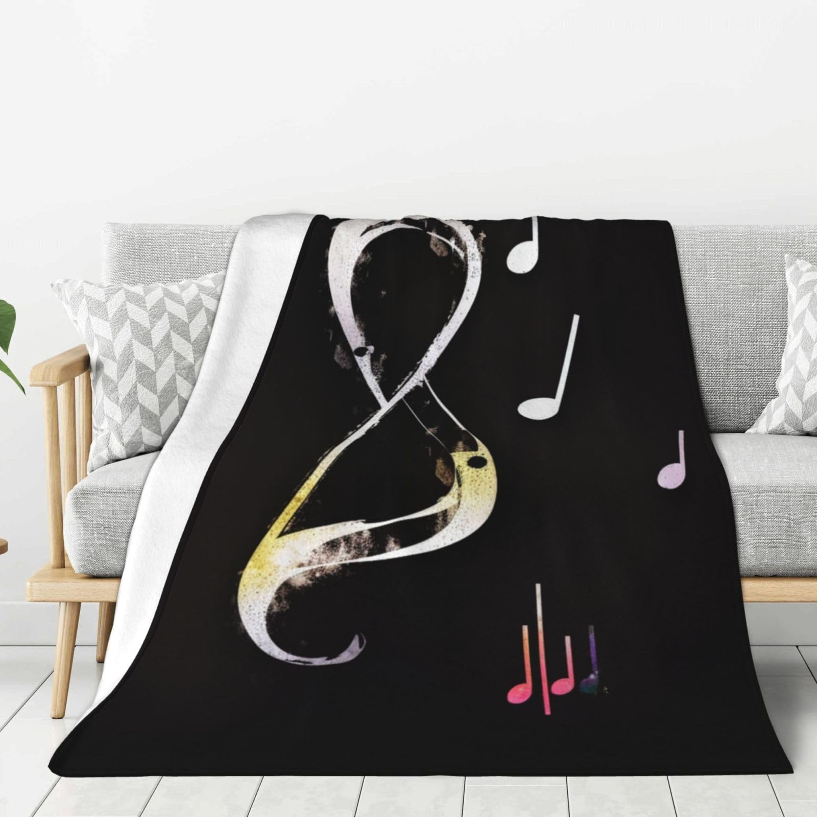 Couverture pour canapé et lit au motif musical pour moments cocooning