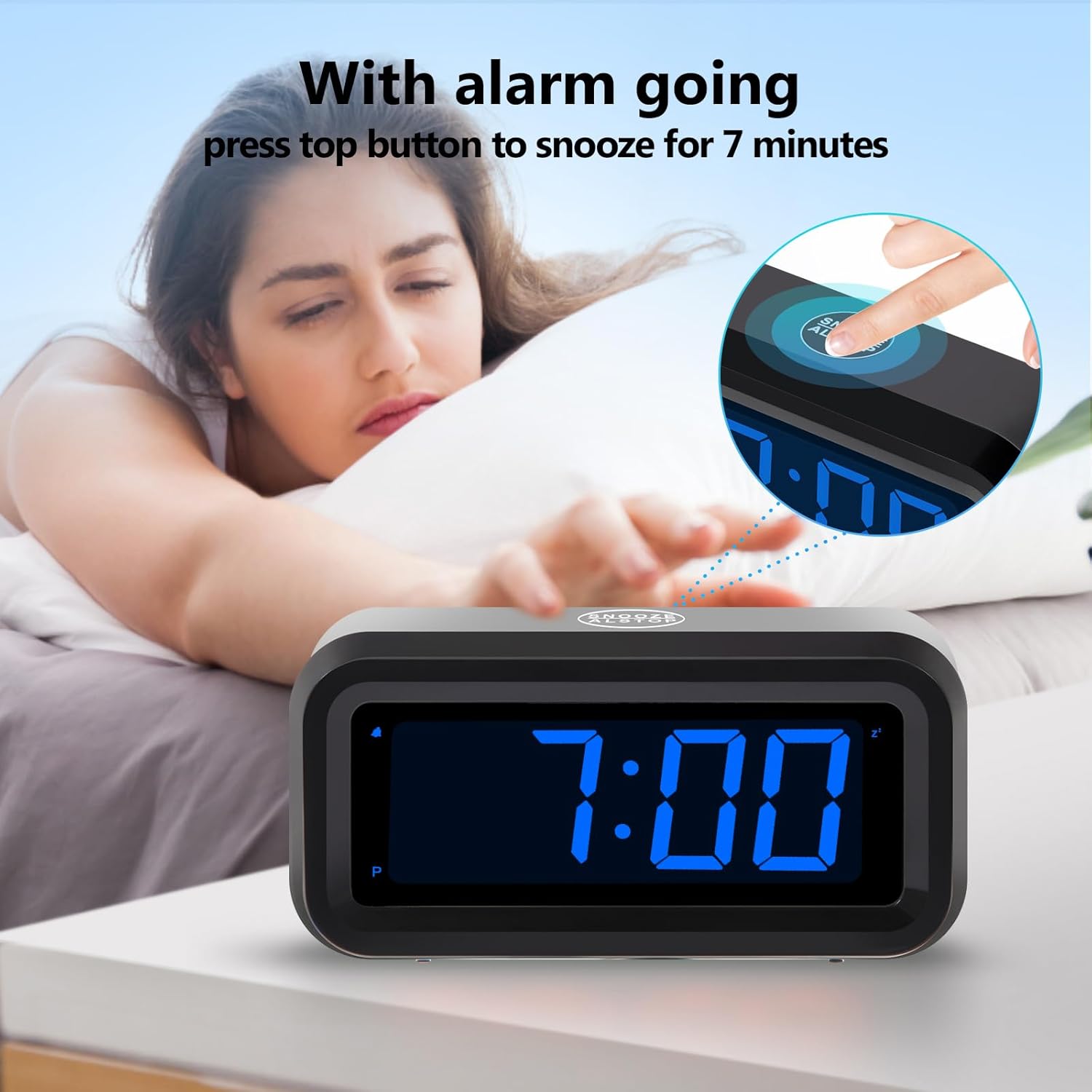 Hand pressing the top snooze button on the Timegyro Digital Alarm Clock while the alarm is sounding