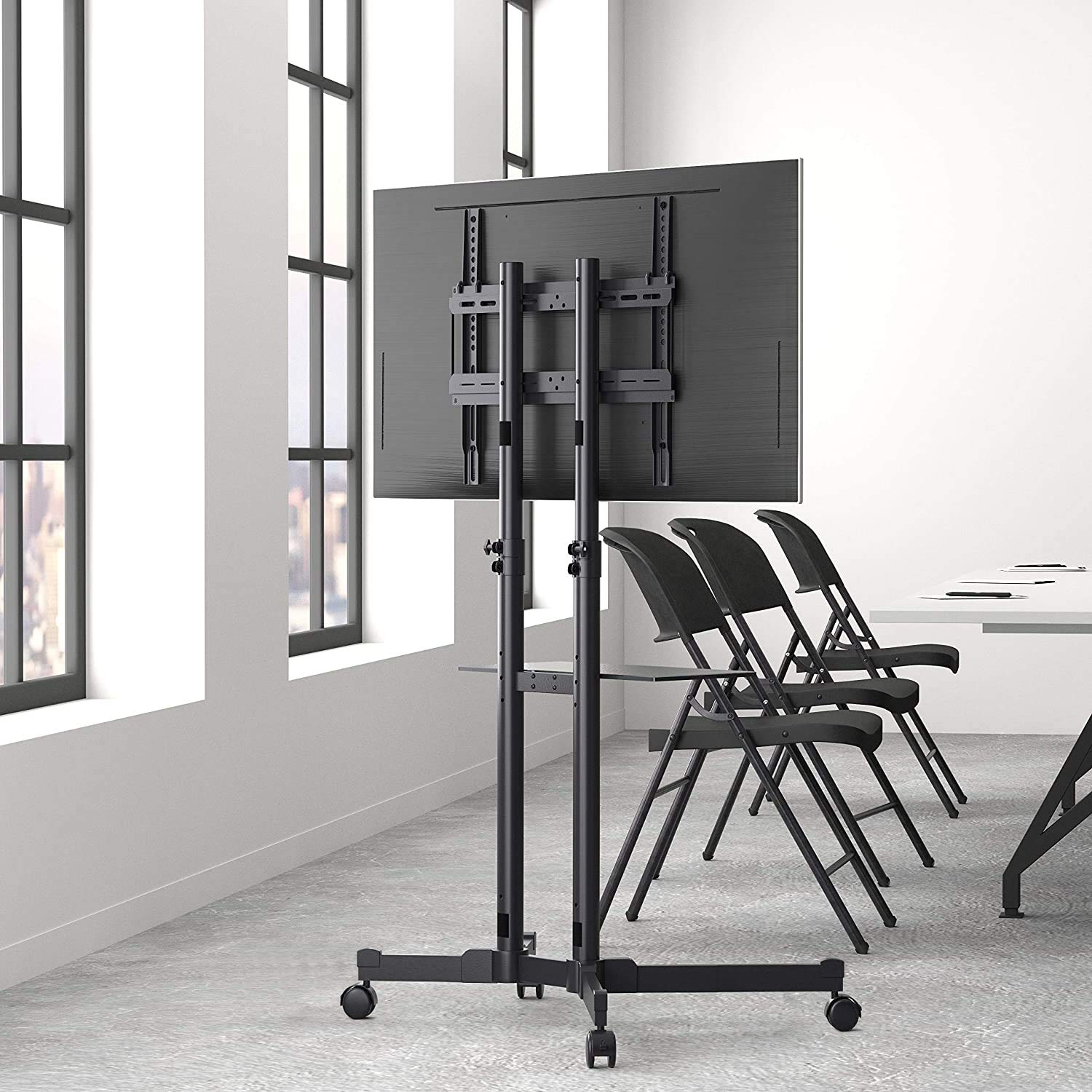 Bag view of AmazonBasics TV Trolley with a television mounted, showing the VESA bracket connection