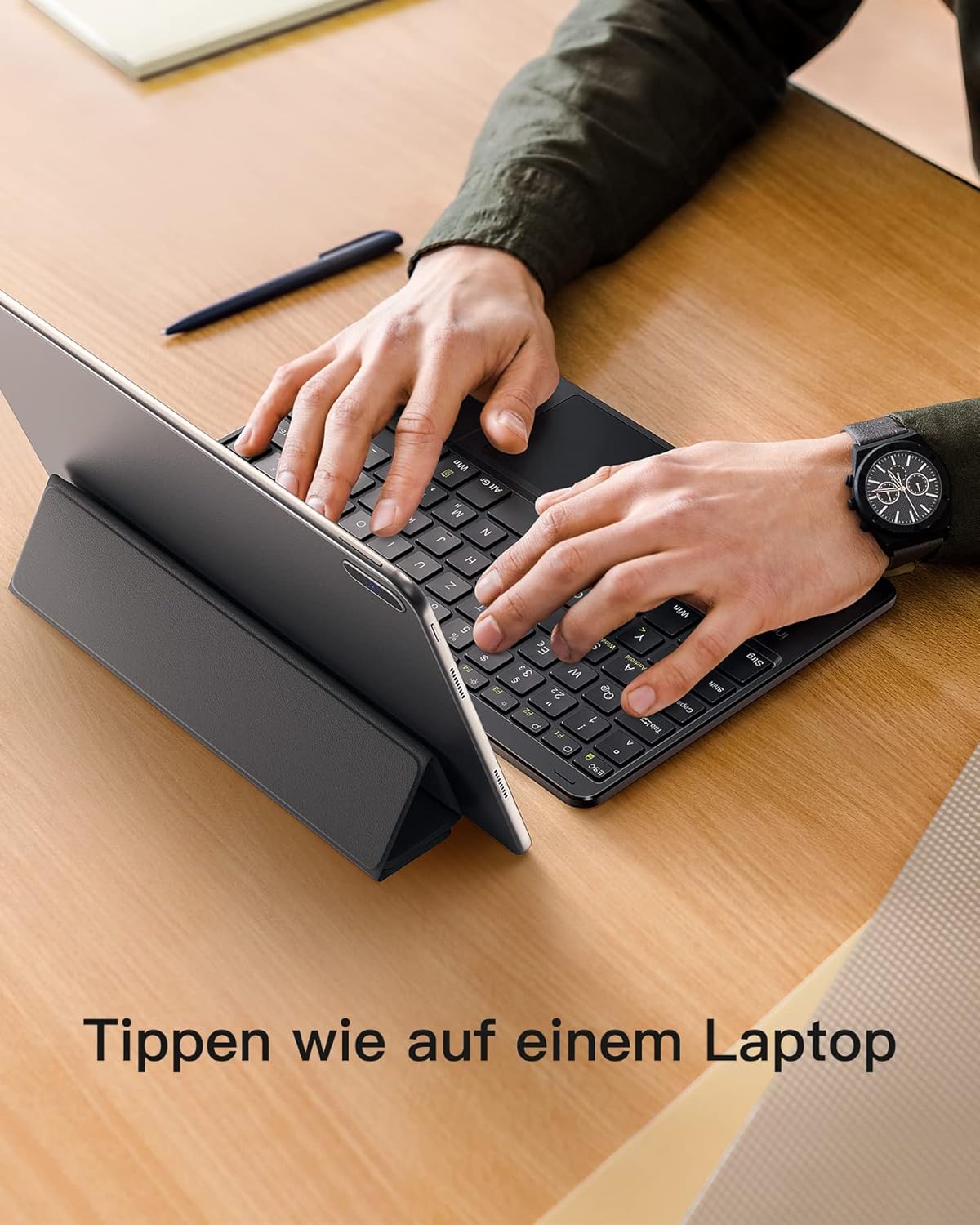 Person typing on the Inateck KB01101 keyboard connected to a tablet, demonstrating a laptop-like typing experience.