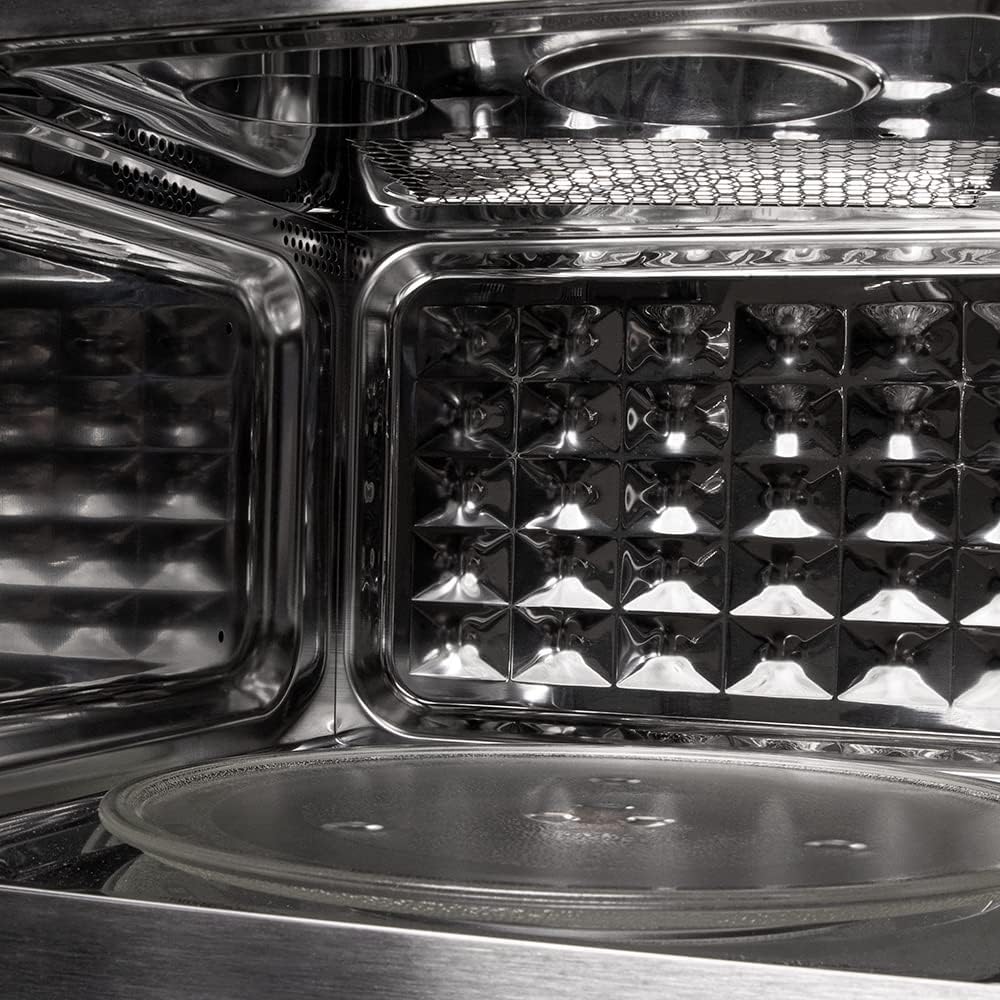 Enterijer view of the Cecotec Grandheat 2090 Microwave showing the turntable and grill element