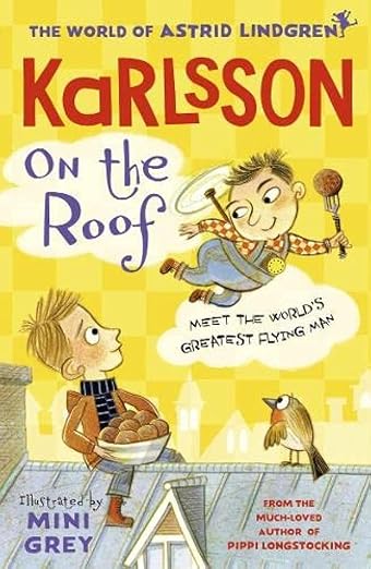 Boy holding a bowl of cookies, sitting on a roof while looking up at another boy in overalls flying above