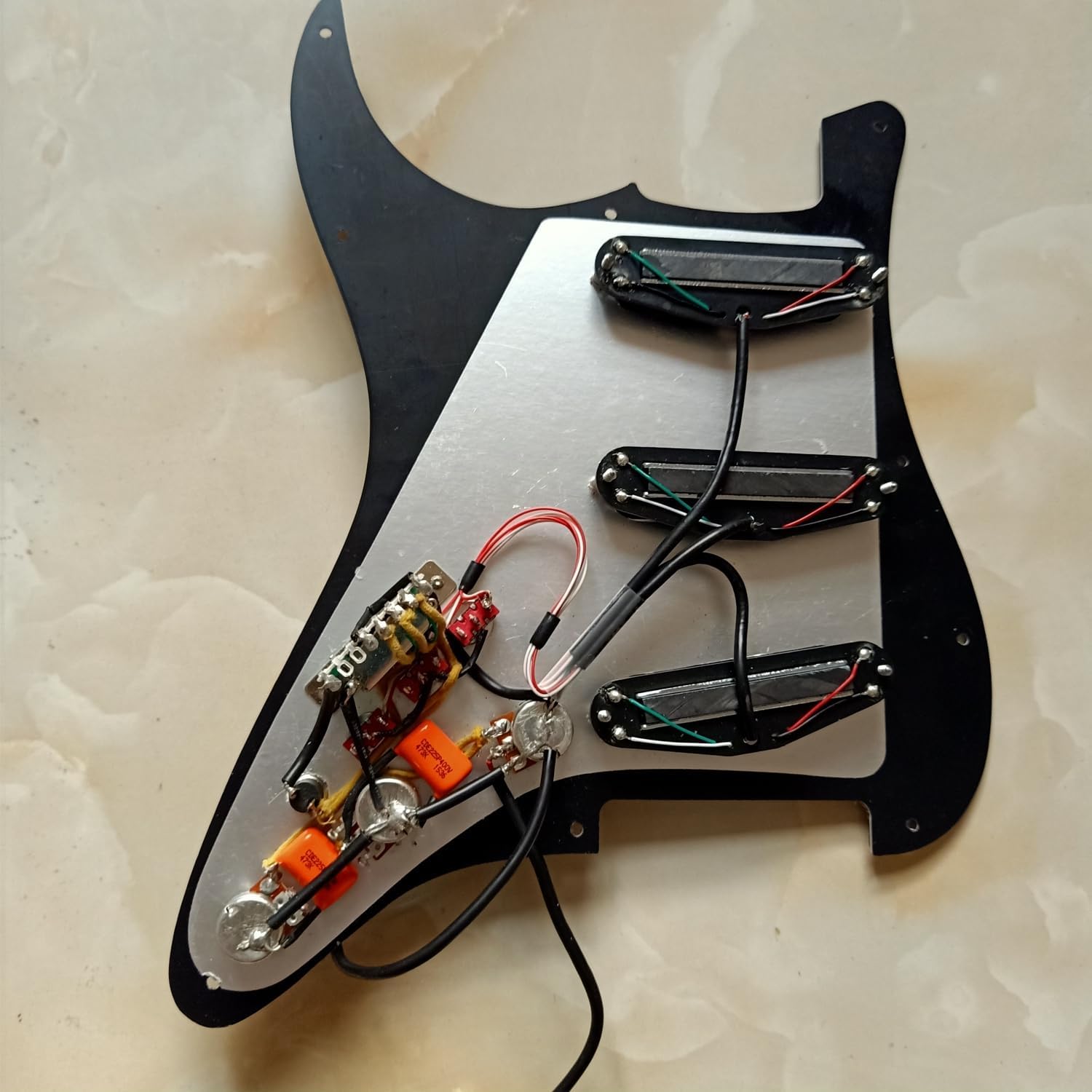11-Hole SSS Prewired Loaded Pickguard with Dual Hot Rail High Output Pickups Set,Multifuction 4 Single Cut Switch 20 Tones Fit for ST Electric Guitar Parts (Black)
