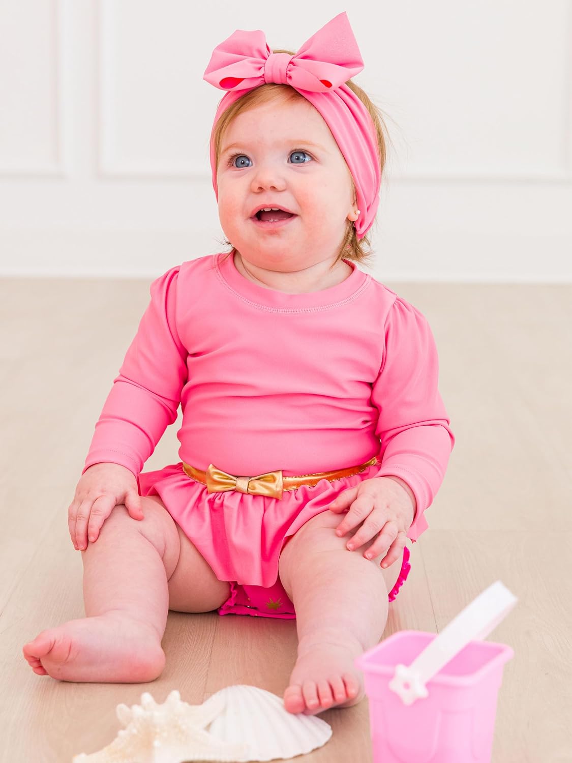 RuffleButts Baby Girls UPF50+ Princess Long Sleeve Bow Skirted One Piece Swimsuit