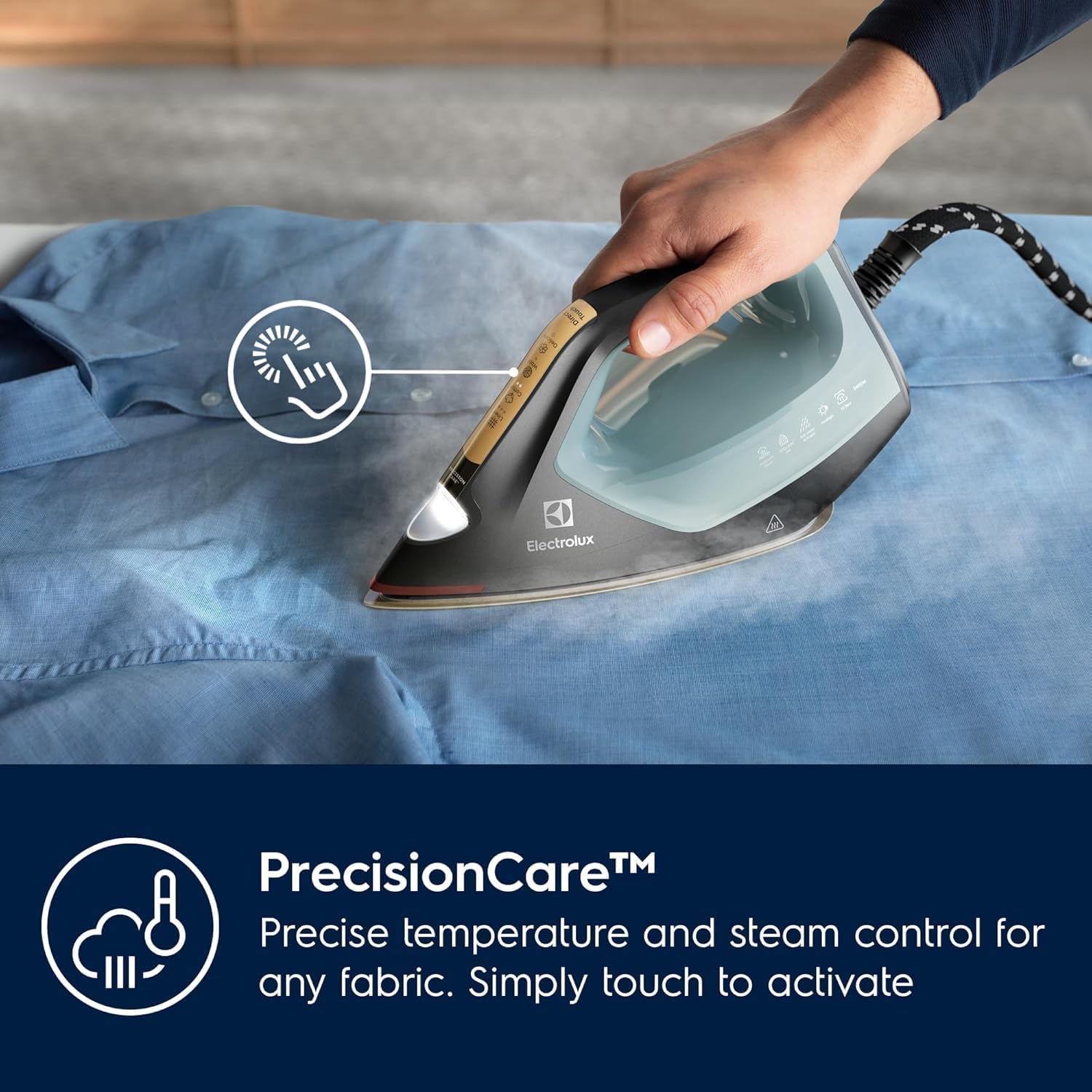 Electrolux Renew 800 Steam Iron with its smart headlight illuminating a blue shirt