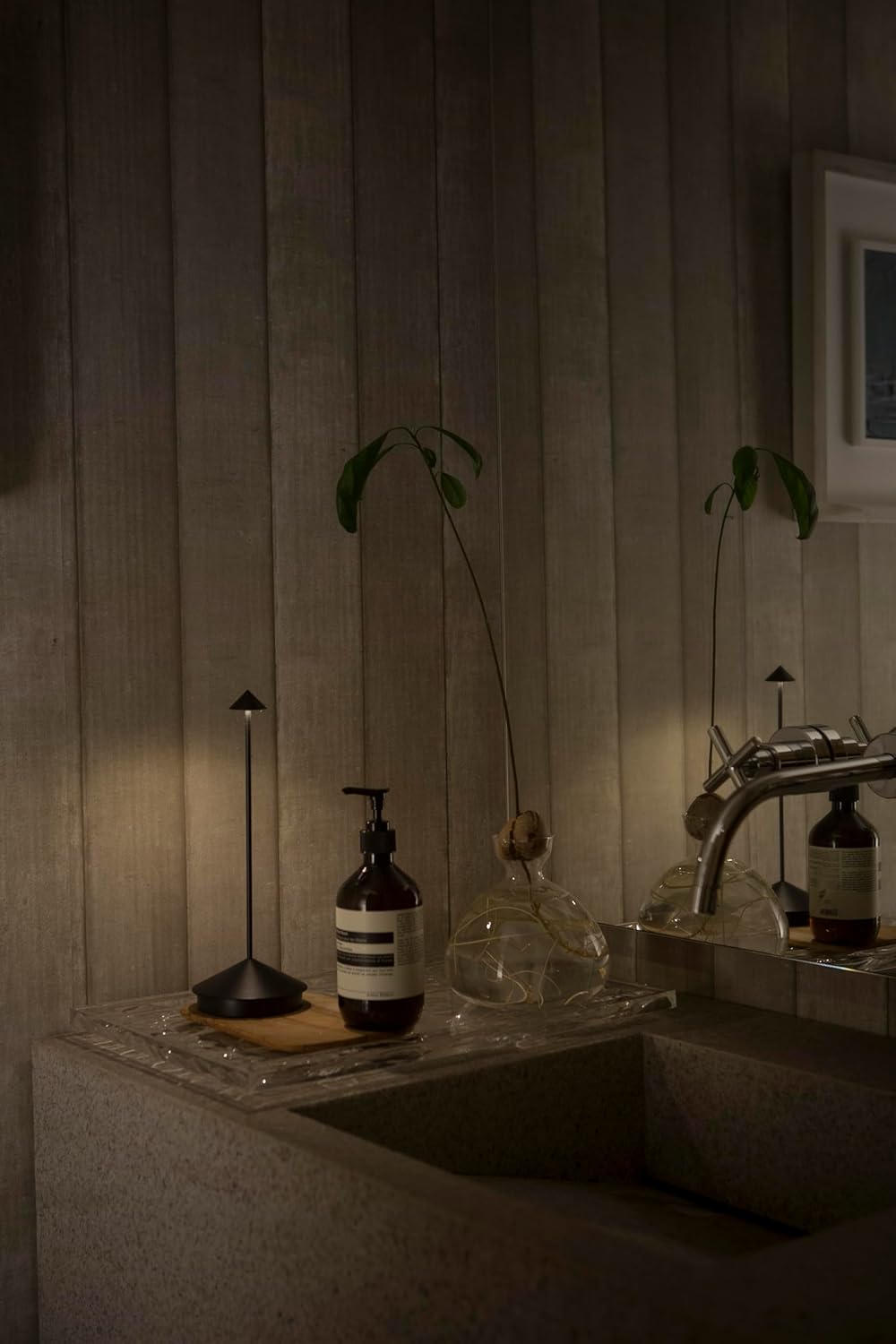 Zafferano Pina Lamp providing ambient lighting for an outdoor setting.