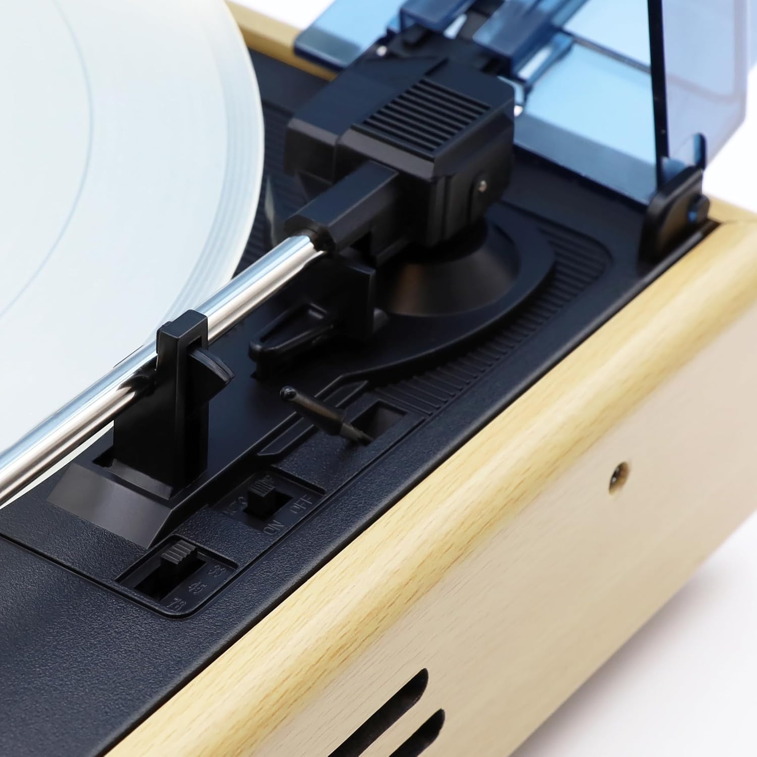 Close-up of the speed selector switch (33, 45, 78 RPM) and the auto-stop ON/OFF switch.