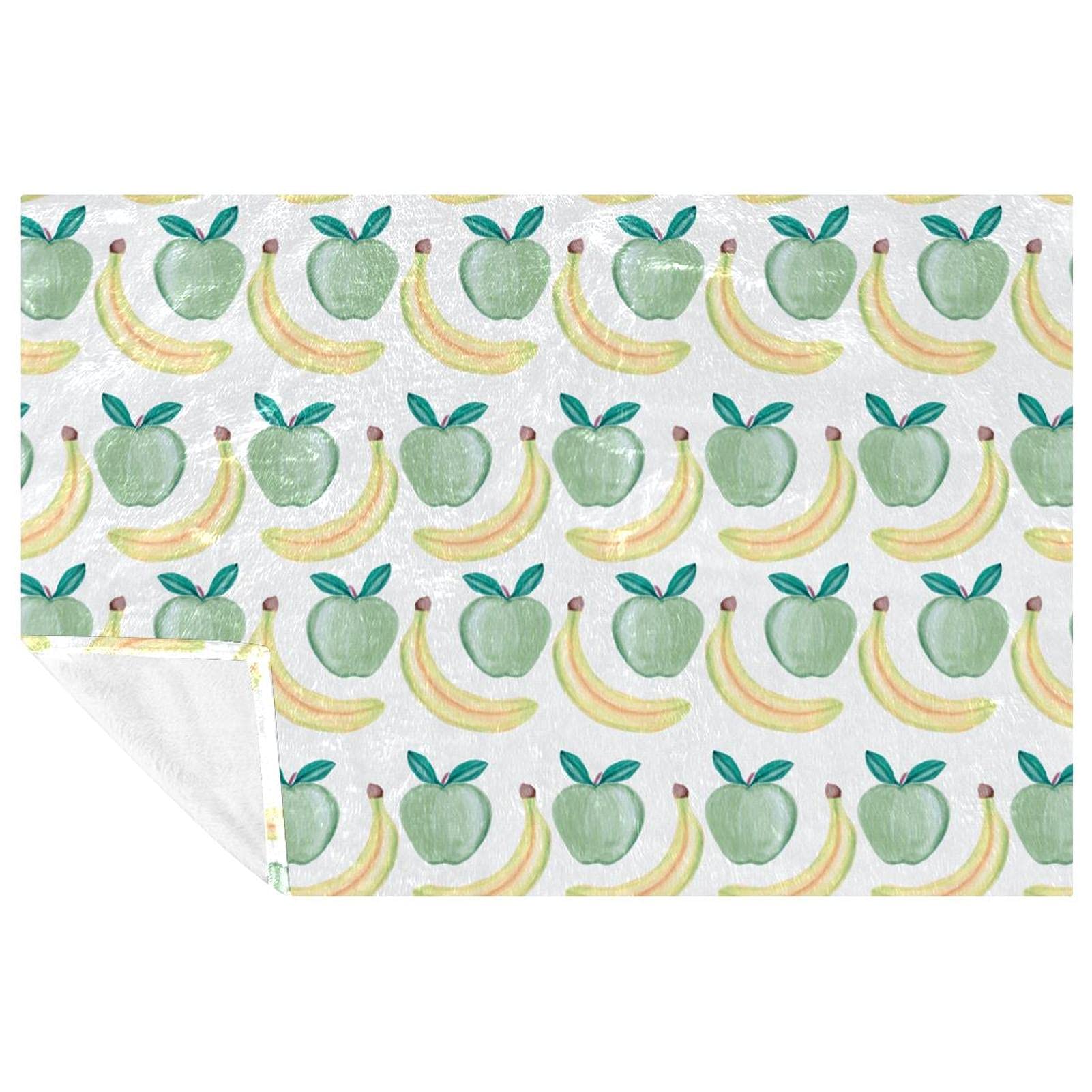 Couverture douce banane et pomme idéale pour un pique-nique ou un canapé douillet