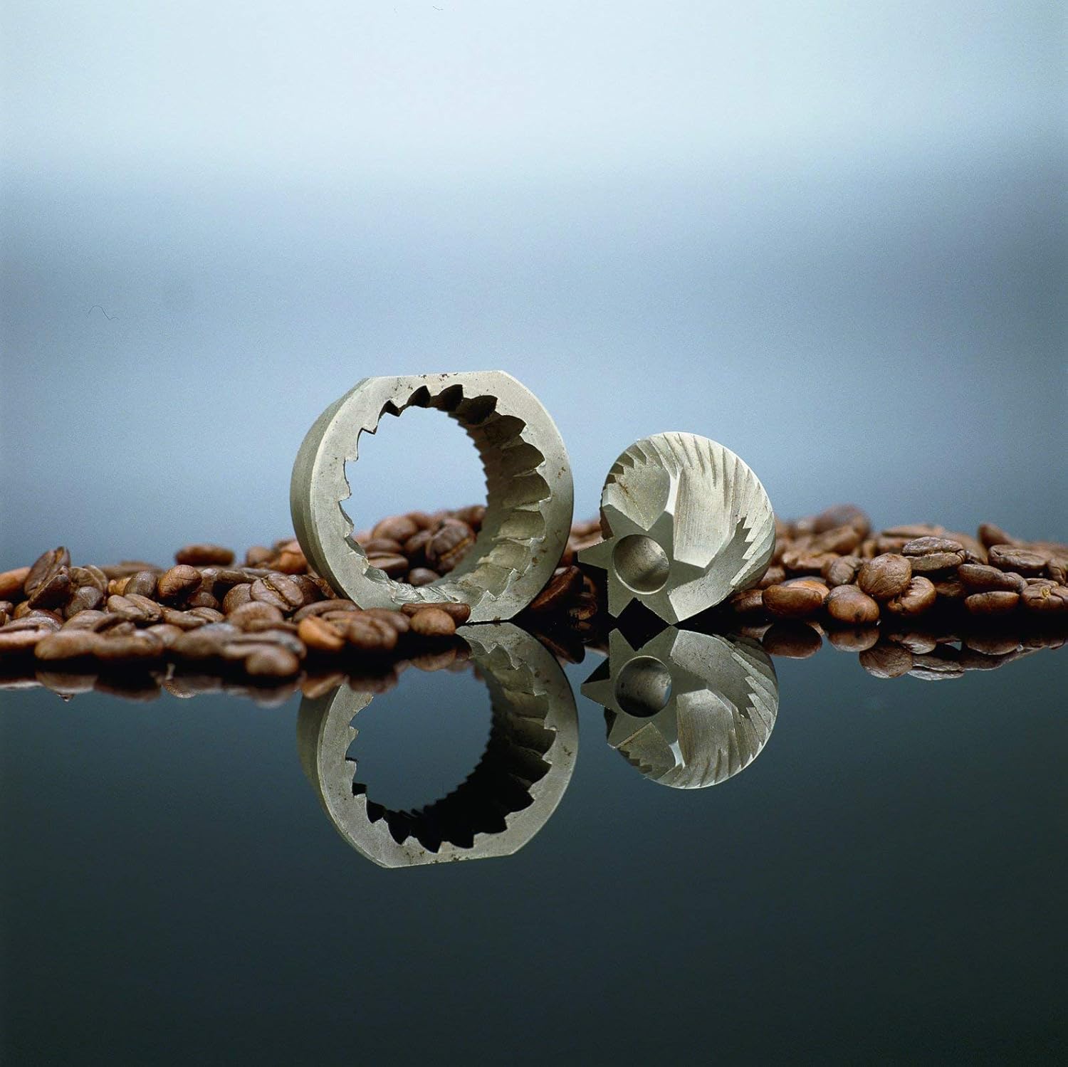 Close-up of the commercial-grade solid steel conical burrs, separated from the grinder