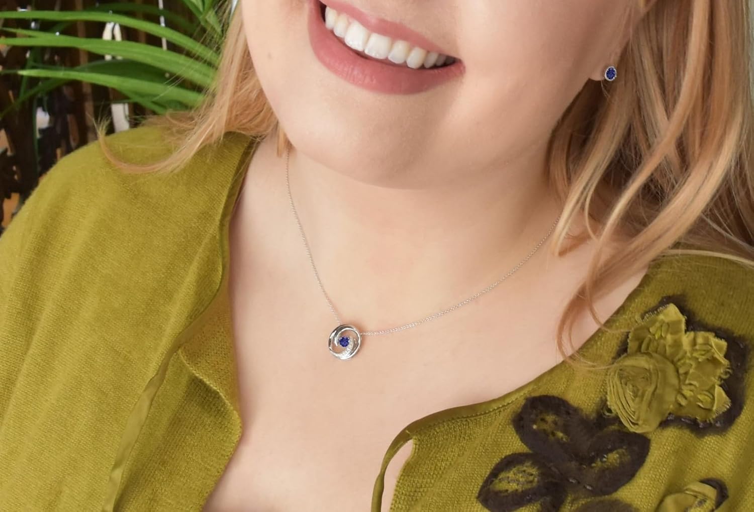 Boston Bay Diamonds Tanzanite & Diamond Accented Swirly Circle Brilliance in Motion Sterling Silver Pendant Necklace (G-H Color, I2-I3 Clarity) - 20”