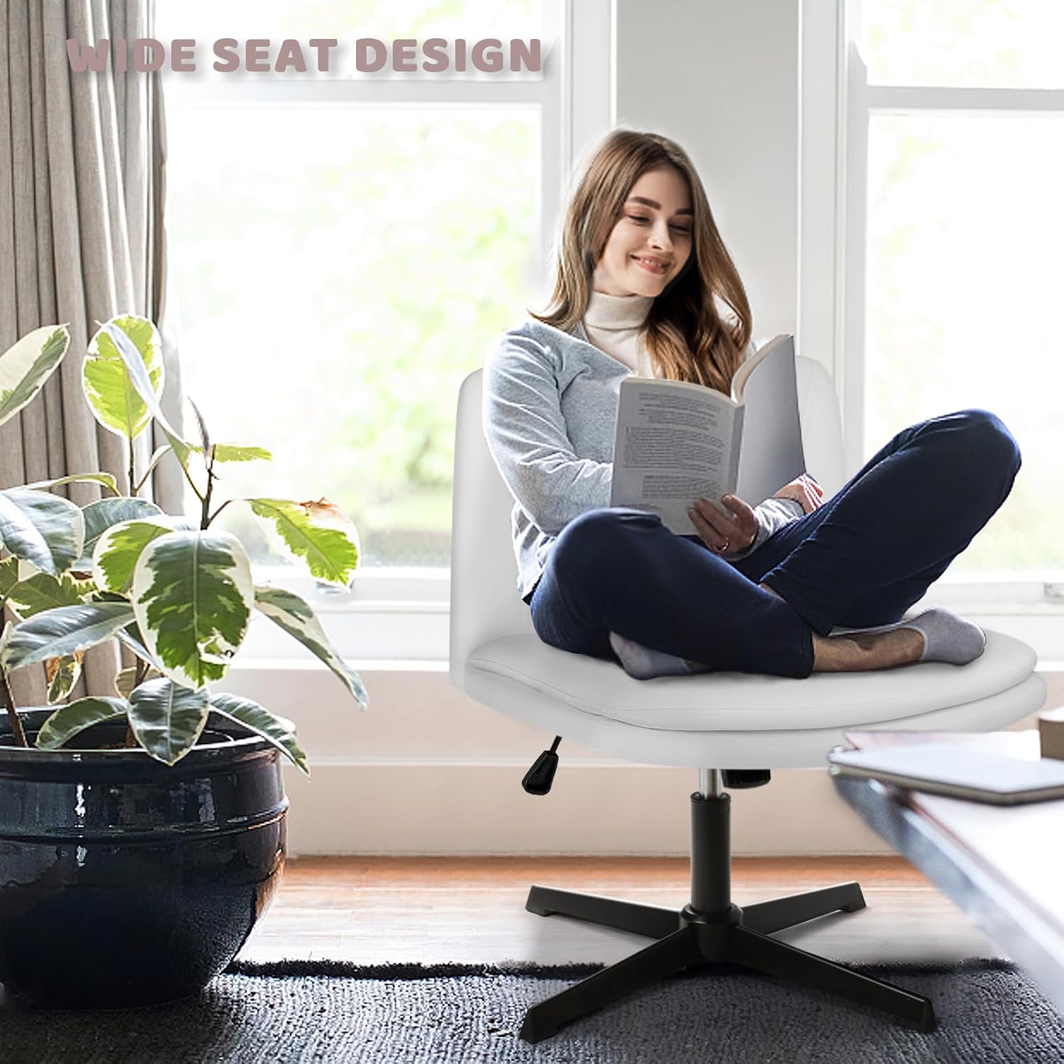 Person sitting criss-cross on the wide seat of the LEMBERI office chair.
