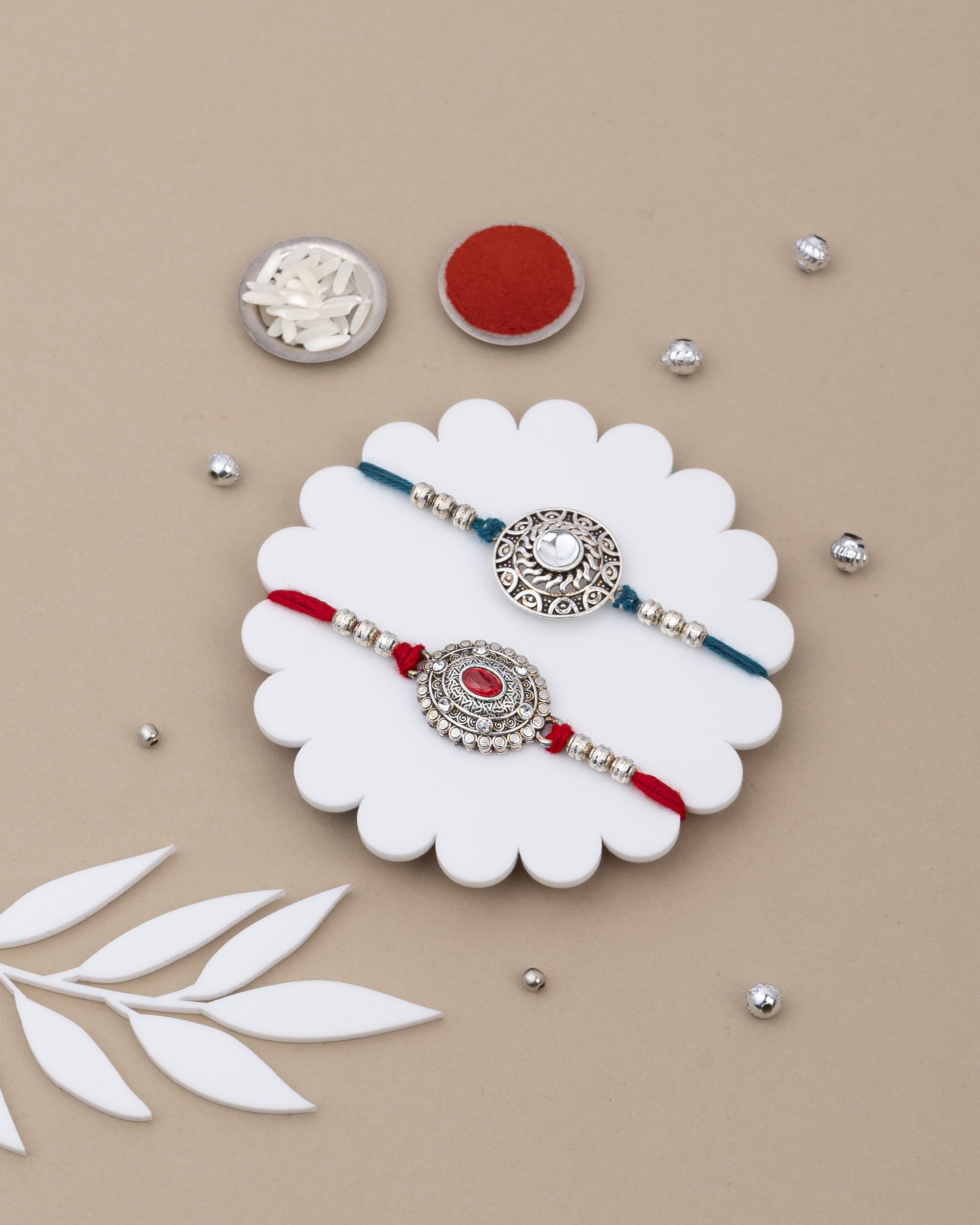 House Of Treats® Rakhi Set Of 2 With Sweets Rakhi Combo With Sweets Rakhi With Dry Fruits For Brother Roasted Dryfruits Cashew Almond Kesarroll Ruby & Sapphire Rakhi Pack Of 2 Rakhi Set With Sweets 1